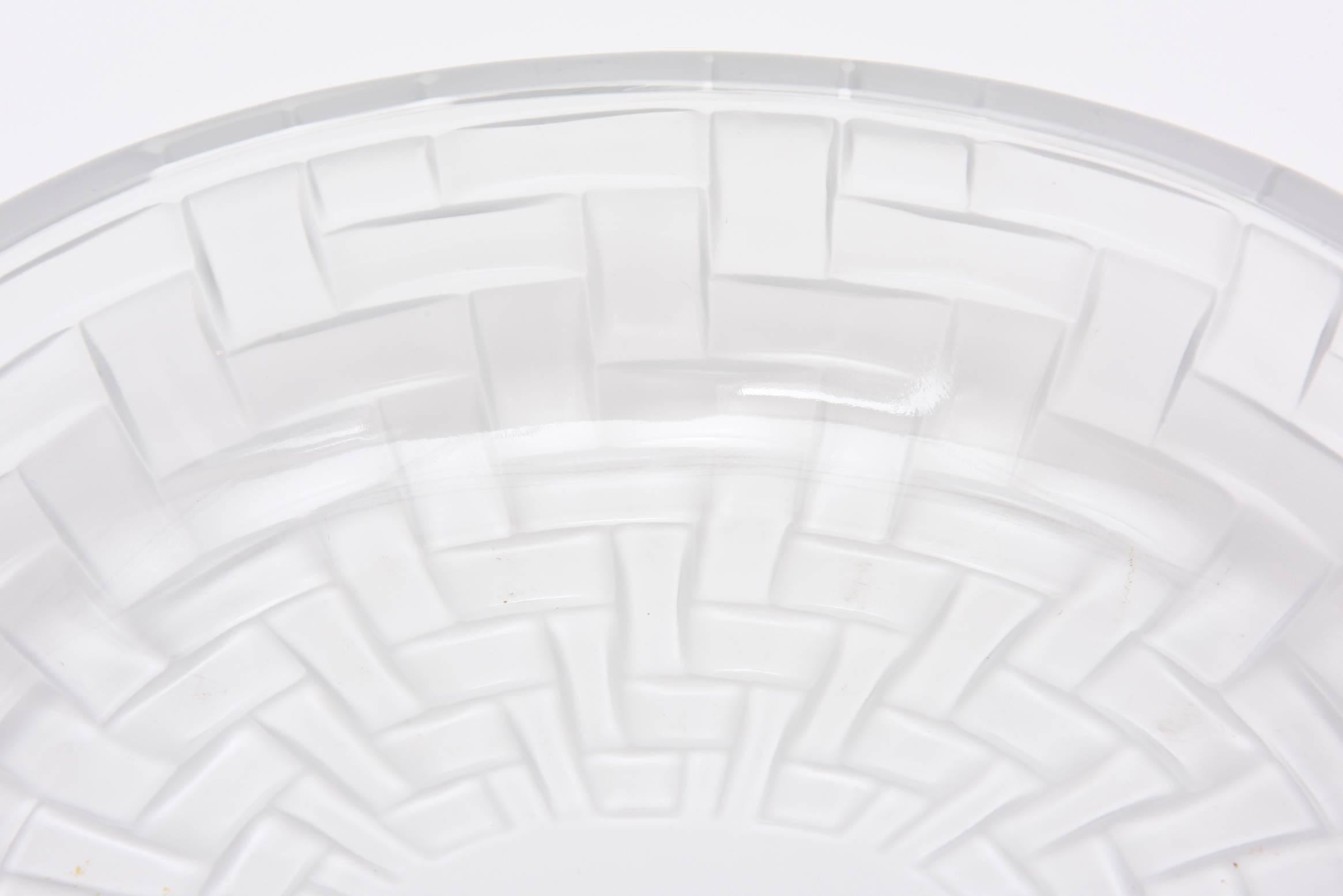 This oval signed Lalique crystal centerpiece or serving bowl is magnificent. It's abstract modernist design and handblown work is timeless. and a forever piece. This is a difficult Lalique pattern to come by now and not seen around.
It is from the
