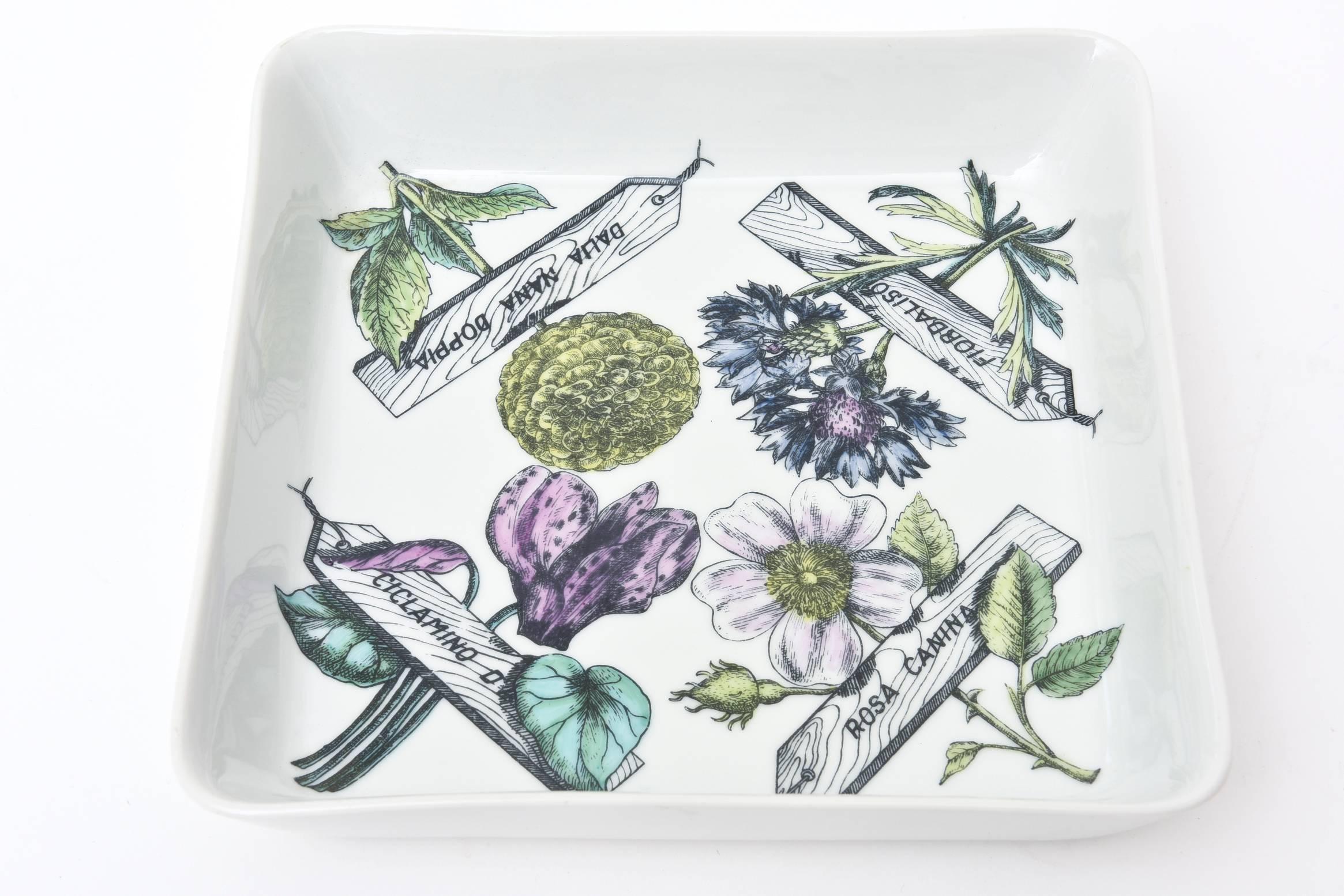 This wonderful substantial sized porcelain square vintage Mid-Century Modern Italian Piero Fornasetti bowl or serving piece has all the elements of botanicals and flowers and is entitled 