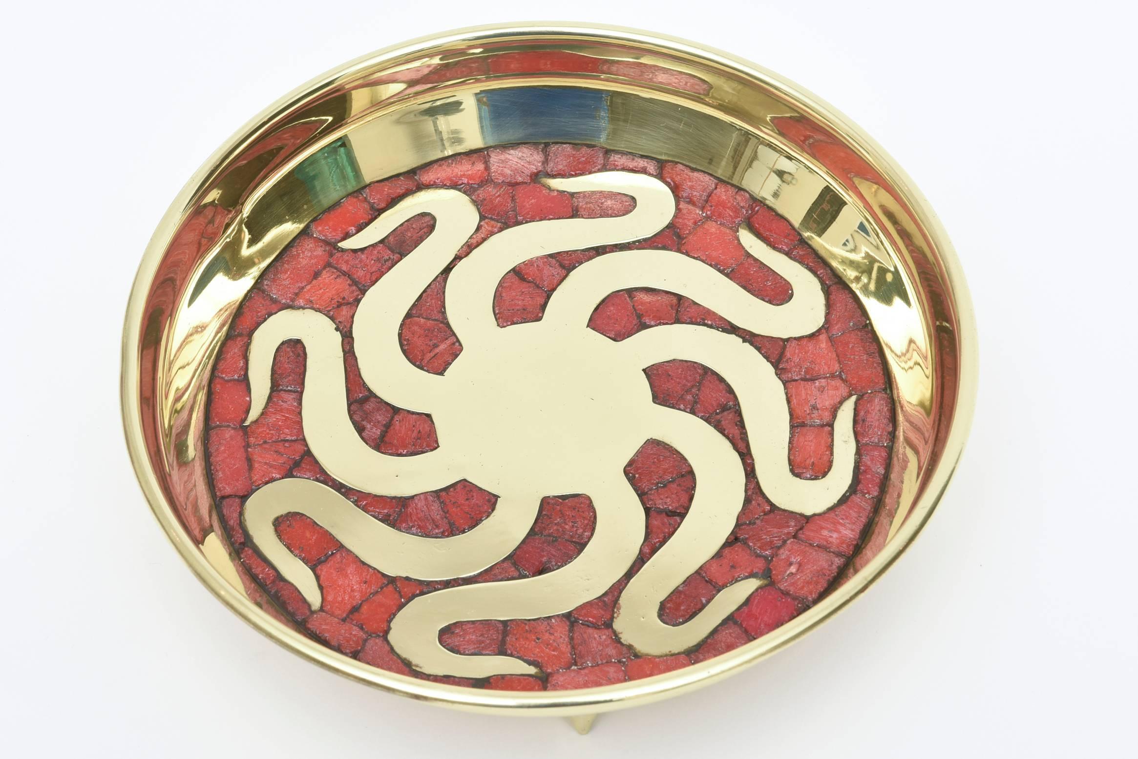 This lovely bowl that is hand-wrought is a beautiful glass mosaic octopus in red.
A more unusual color. The angled feet are sculptural.
The brass has all been beautifully polished. It is signed 