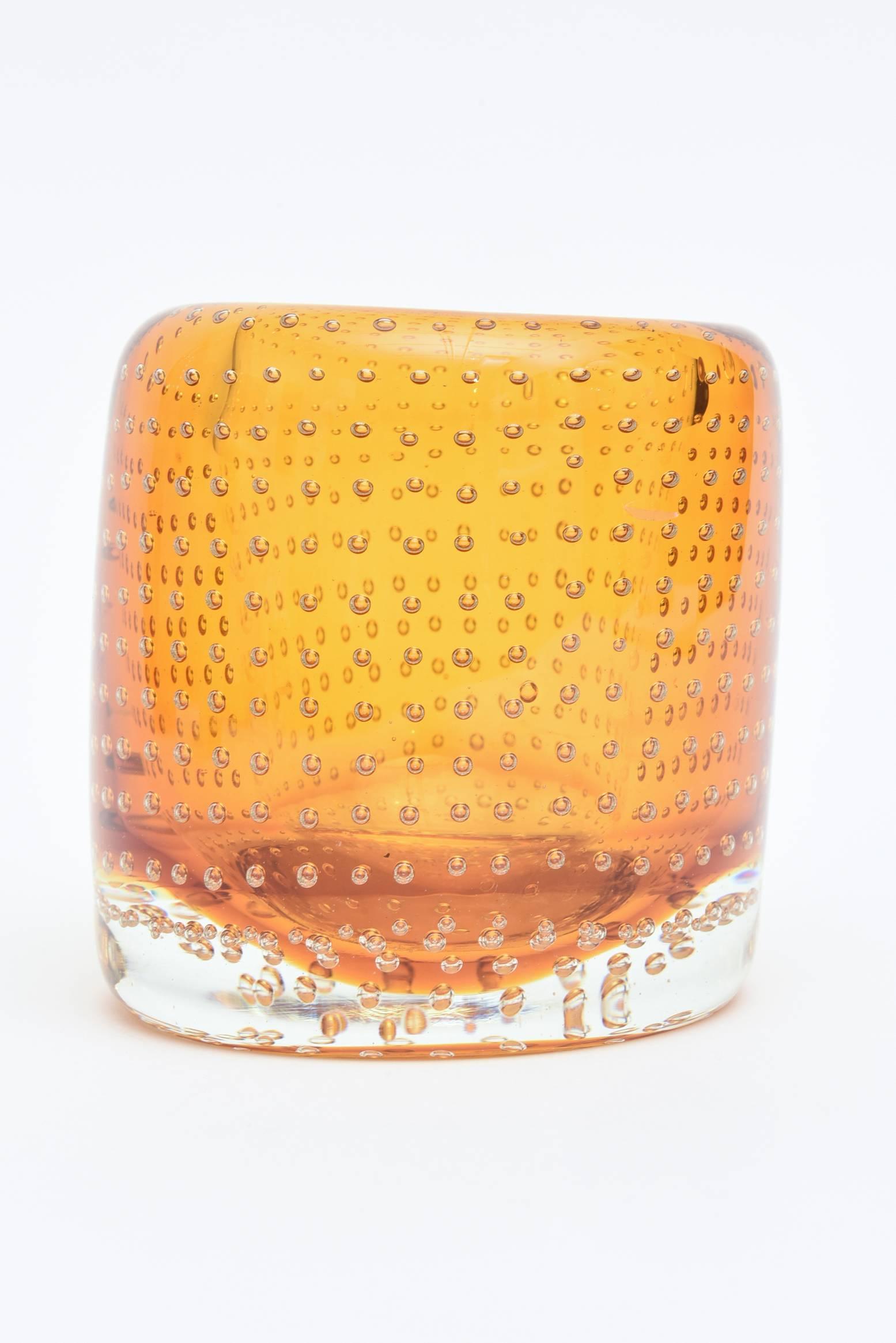 Tons of beautiful floating bubbles in this heavy Seguso Italian glass small vase.
The color is amber yellow... with clear glass bubbles. 
Could also be a candleholder, vessel or bowl for serving or small vase. eat weight to it and the color is