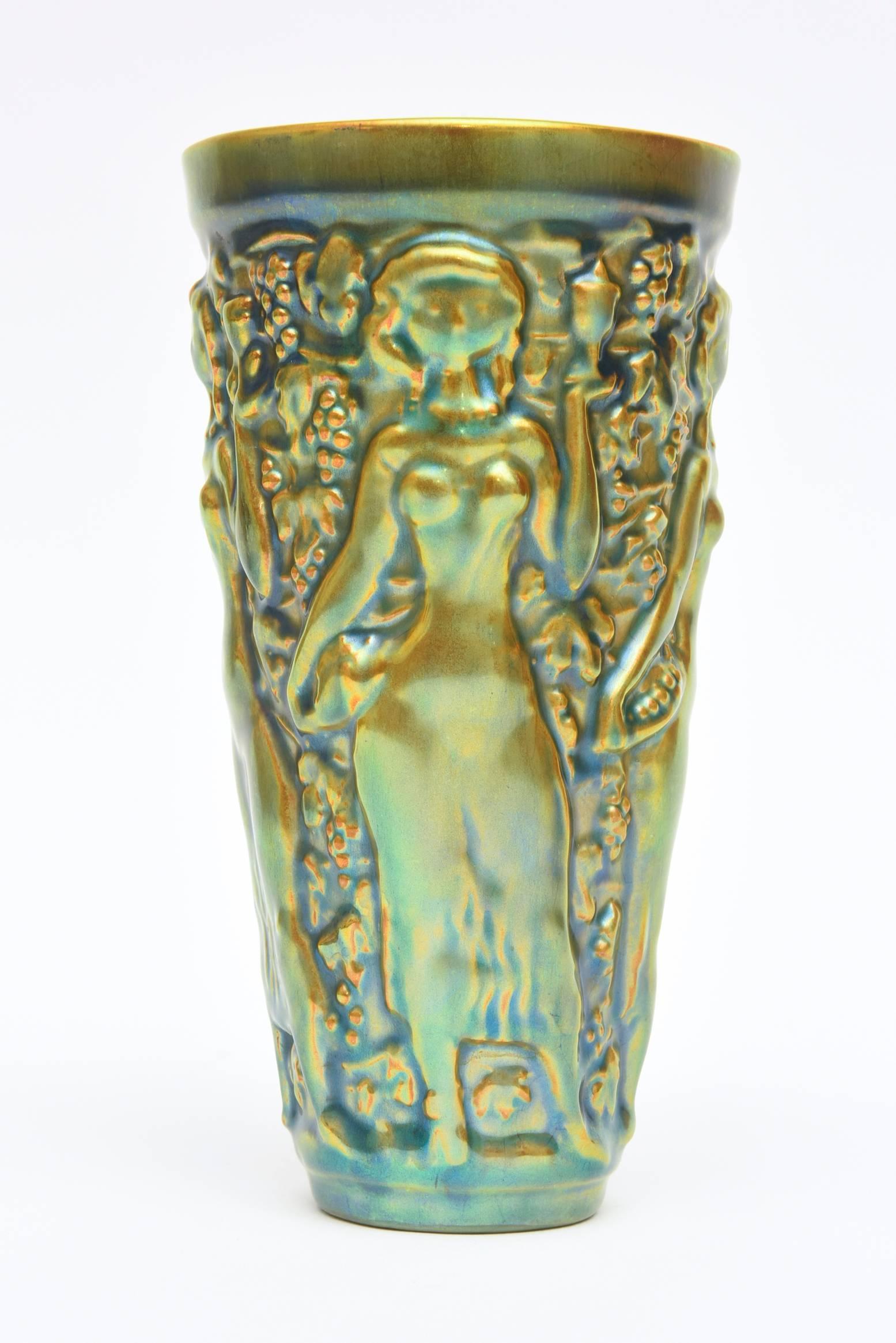 This very vintage textural and raised forms of this glazed ceramic vase is by the Hungarian artist named Zsolnay. It is a glorious combination of color of elegant sensual nude reliefs in this small vase, vessel and decorative ceramic luster glazed