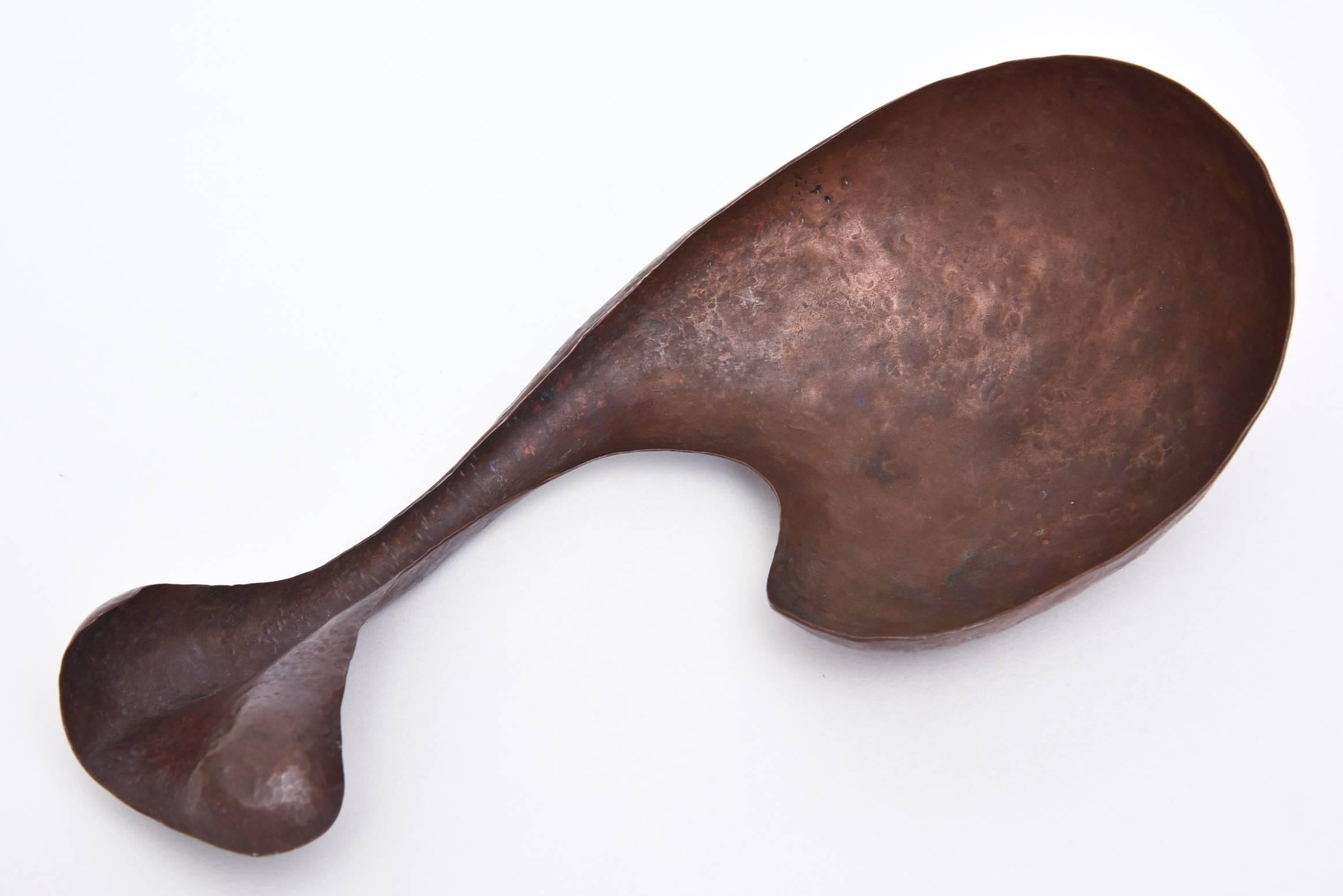 This Mid-century hand-hammered object/sculpture has the form and feel of Jean 
Arp. The patinated copper resonates with a rich under and over tone.
This is very week done and made... and quite vintage. It is organic modern meets bio-morphic form