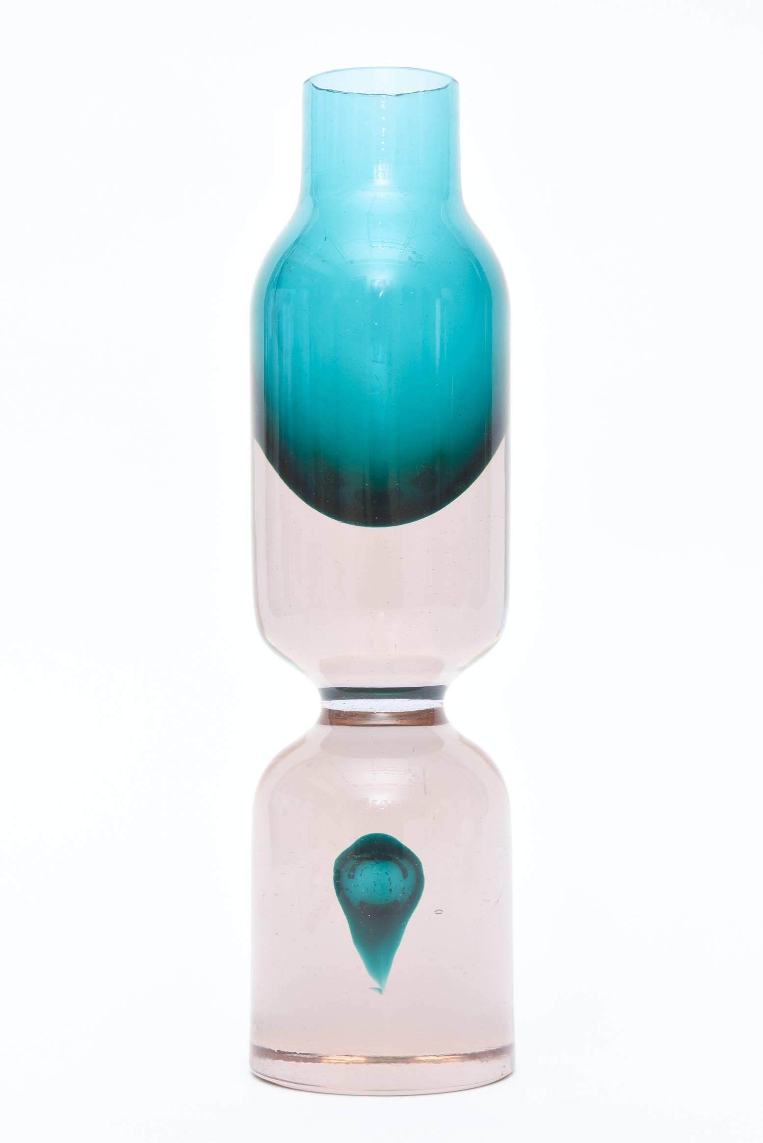 The combination of the two luscious colors of this vintage Italian Cenedese Murano vase, vessel or sculpture has the floating teardrop at the bottom in teal turquoise. It is set against a rosy pink to clear interior. It is as if the teardrop is