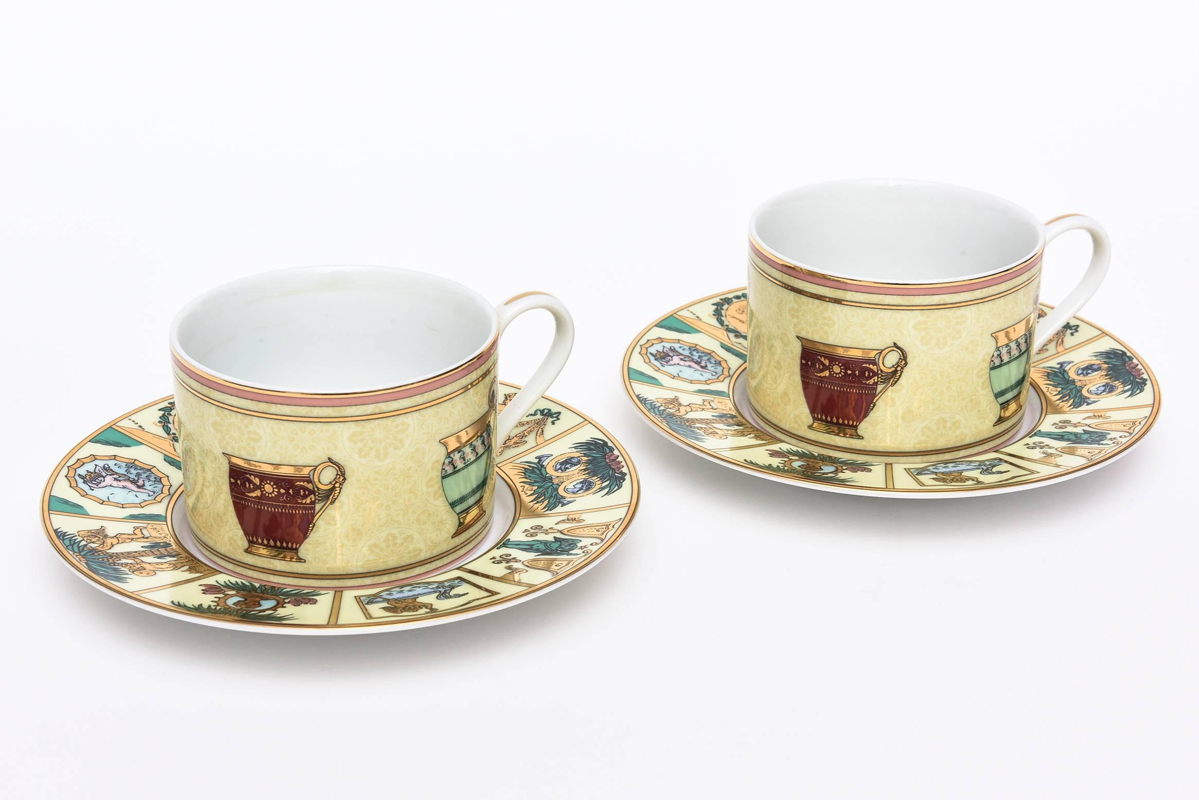 What a way to be served coffee or tea! This pair of Gucci original porcelain Greek mythological coffee/tea service for two has beautiful renditions of symbols in a great array of colors.