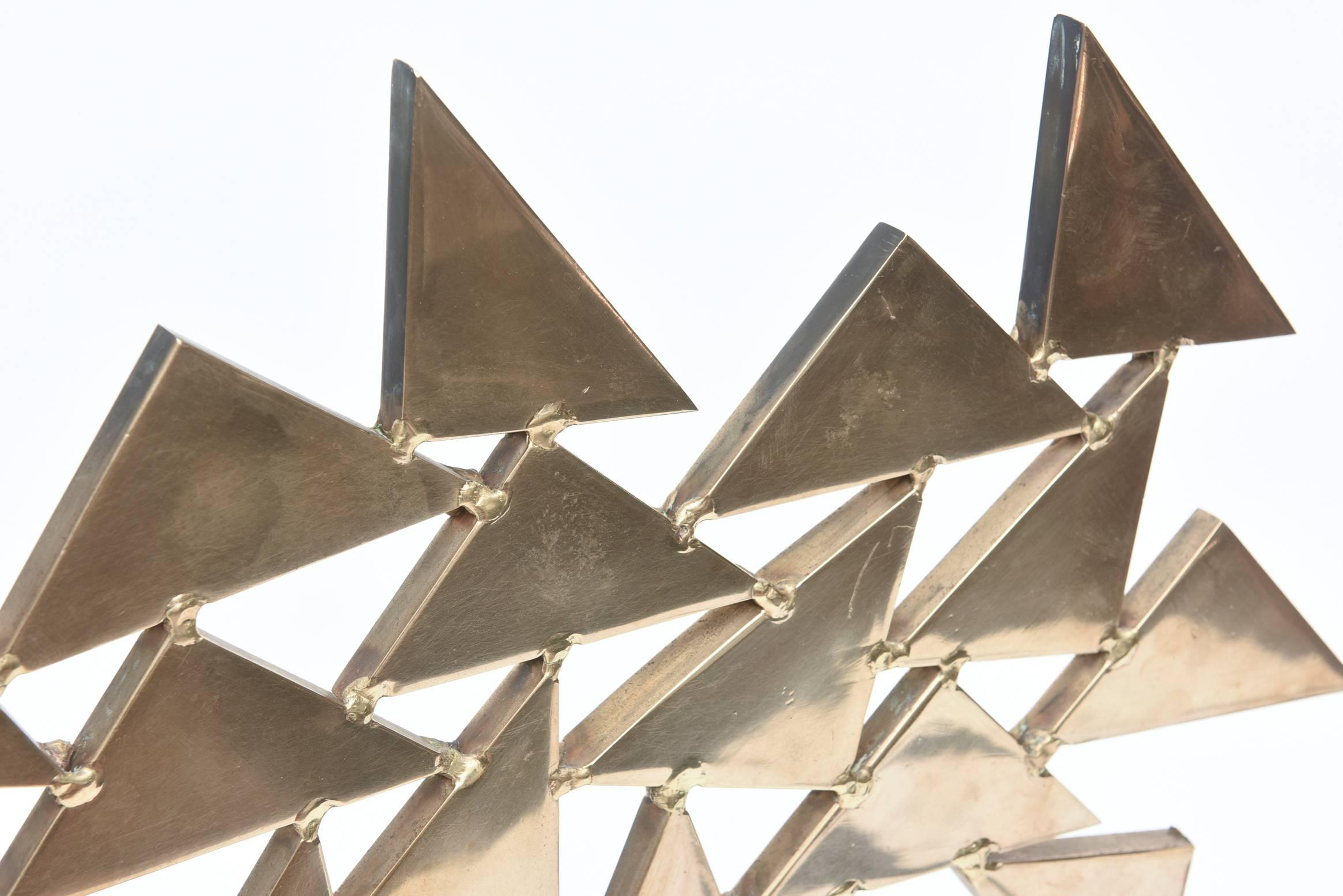 This French two-part fantastic large and arresting solid brass abstract sculpture has connected and welded triangles that give it dimension and form. It has great geometric lines of triangles and has great weight to it. It is one of a kind and from