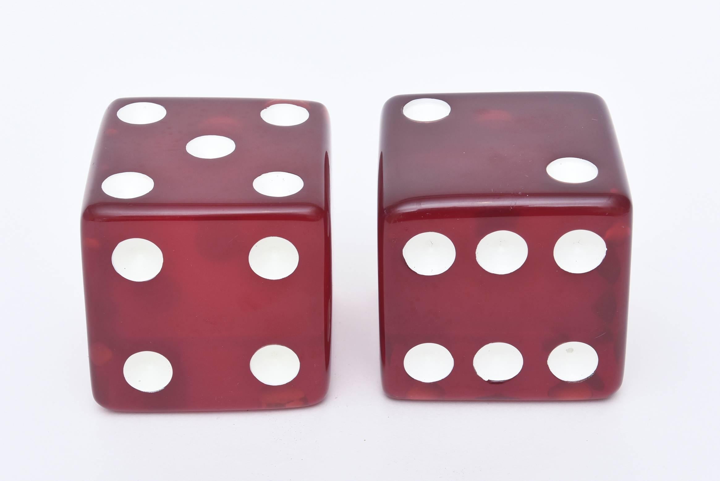 These fun, sculptural and large pair of red dice have white enamel dots.
They are a great conversation piece and the color red is fabulous and more desirable ands harder to come by.
  