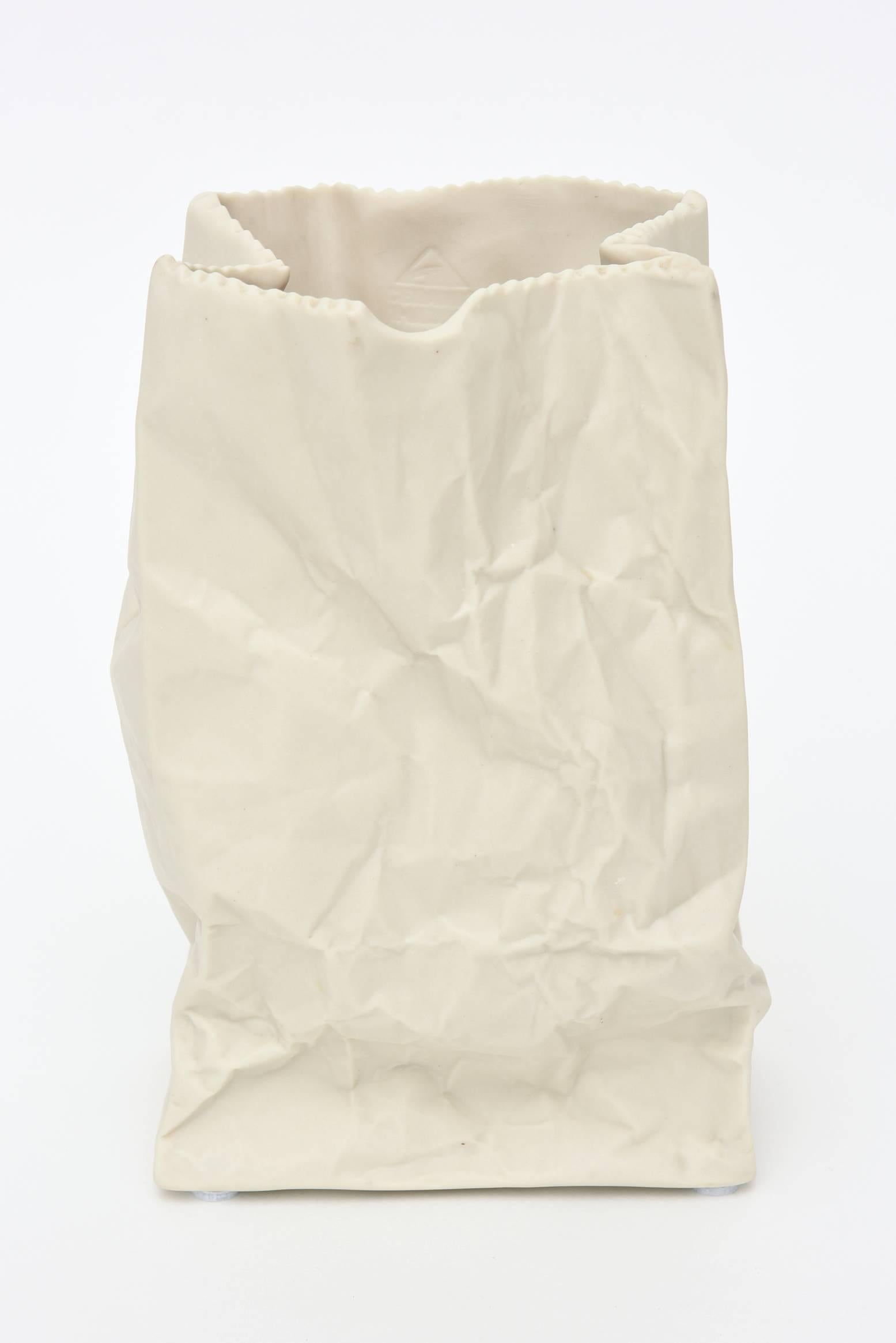This off-white ceramic sculptural crushed bag is a great vase or just a great object/sculpture. It has the influence of Claes Oldenburg: pop artist.
It is from a California company and resembles the Rosenthal bag. This one is bigger. It is organic