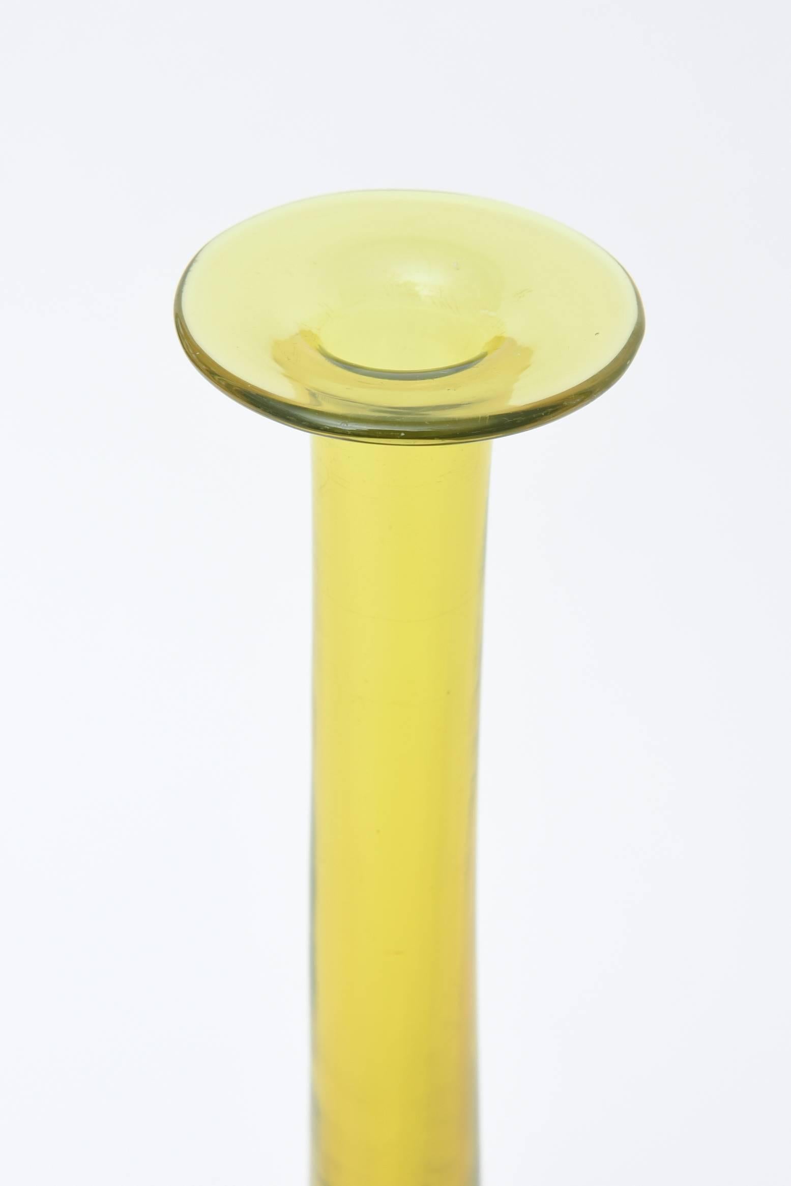 The play of luscious chartreuse and purple meet in this gorgeous Italian Murano Sommerso vintage glass long bottled neck vase or vessel or object. It is the work of Seguso and is signed. The colors and shape are spectacular. It is of good weight. It
