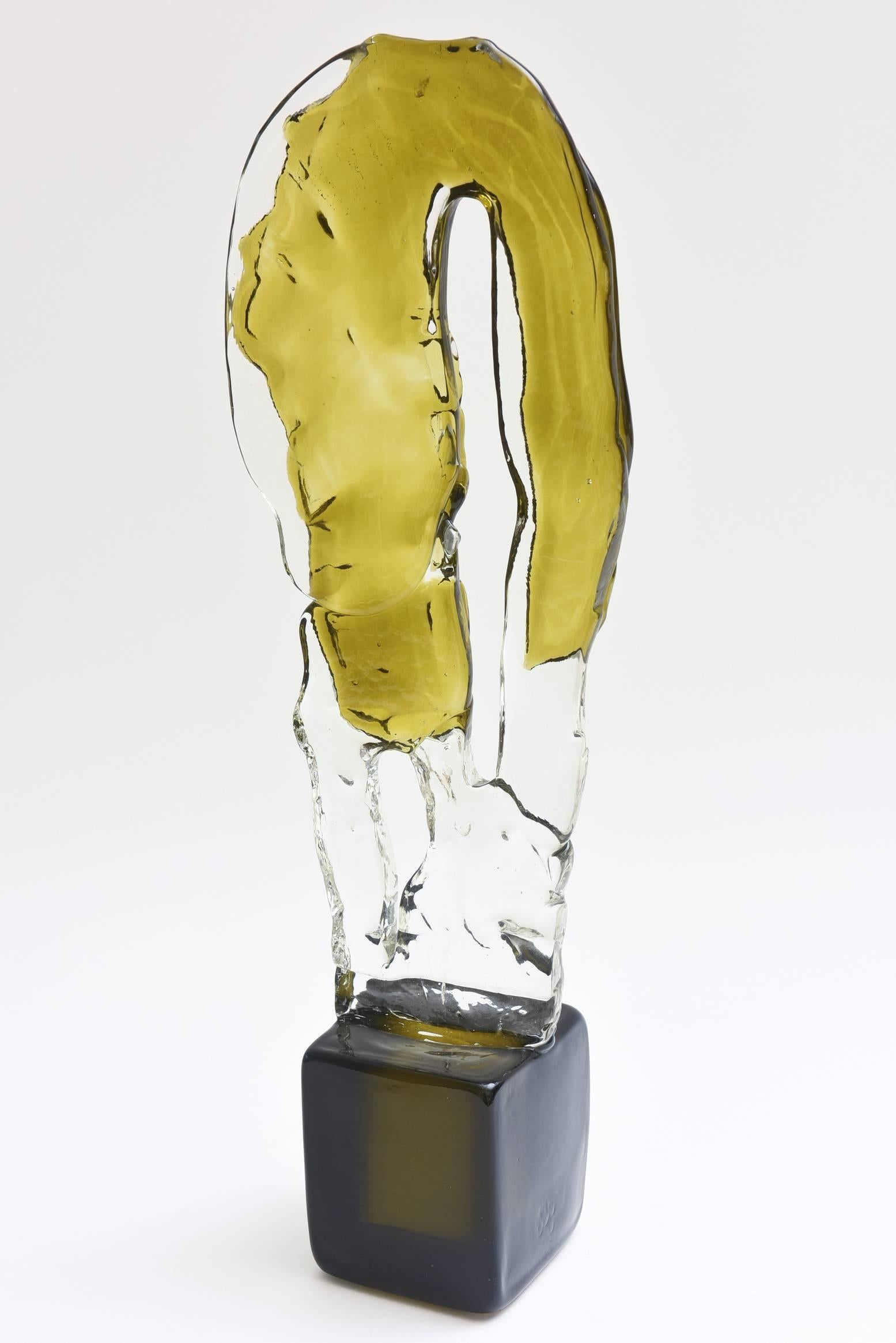 This gorgeous and amazing tall glass Murano sculpture looks like chipped ice in 
chartruese, clear as the body and dark forest green/black as the base.
It is signed Salviati Murano.
The horseshoe shaped inverted glass is encased with chartreuse