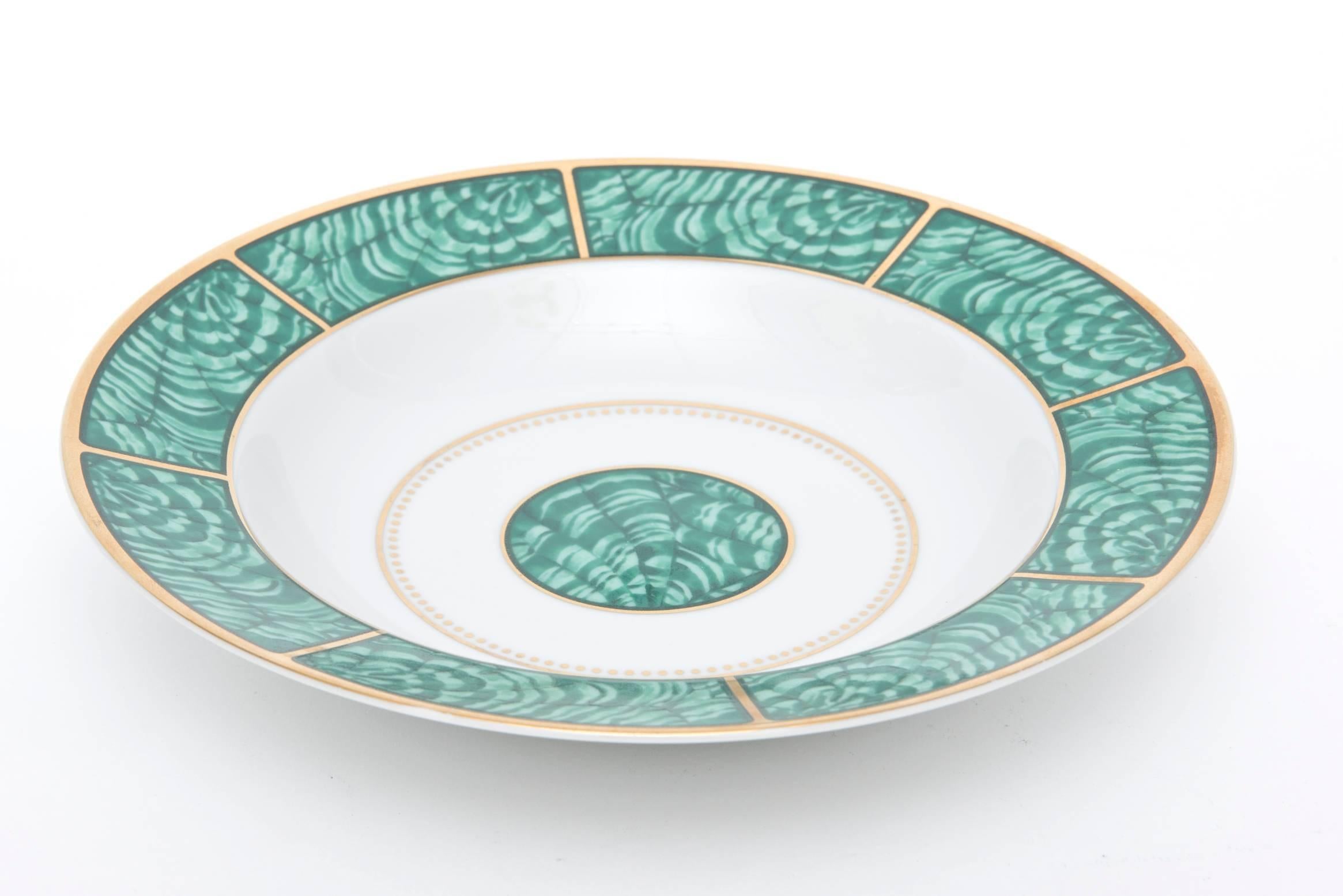 The beautiful design of malachite rings with gold and white in this very imperial looking porcelain china service for four made by Georges Briard vintage from the 1960s. It consists of a dinner plate, salad or desert plate, soup or salad bowl and