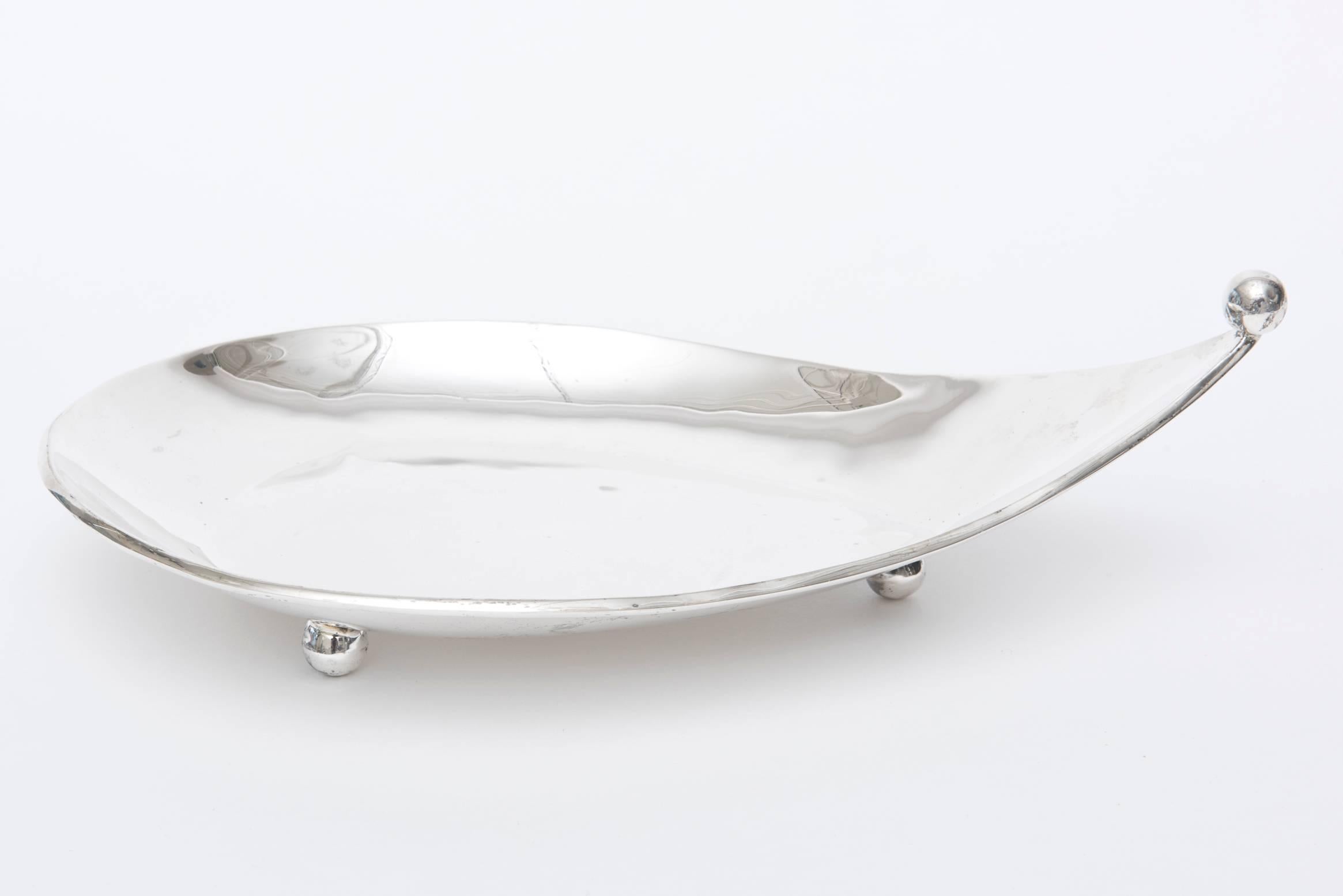 This beautiful hallmarked mid century modern sterling silver bowl and or tray has a beautiful sculptural shape with three round ball feet. There is a round ball at the tip as it dips upward. It is signed Sterling 925 Hecho en Mexico, so it is early