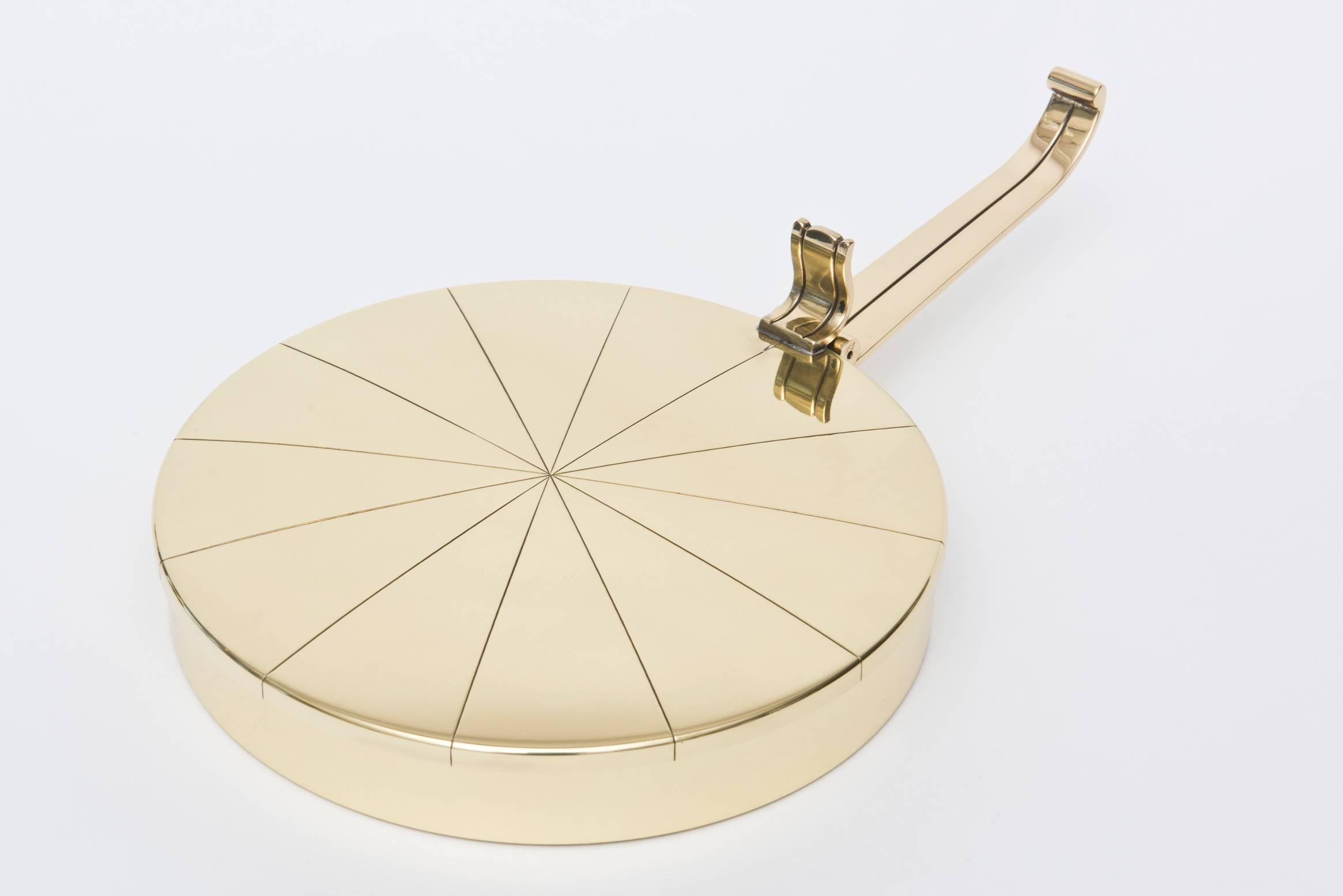 This Mid-Century Modern Tommi Parzinger for Dorlyn Silversmiths is hallmarked on the back. This chic brass box back in the times of the 1950s was s silent butler tray to pick up the crumbs at the elegant lavish dinner parties for the elite. Now it