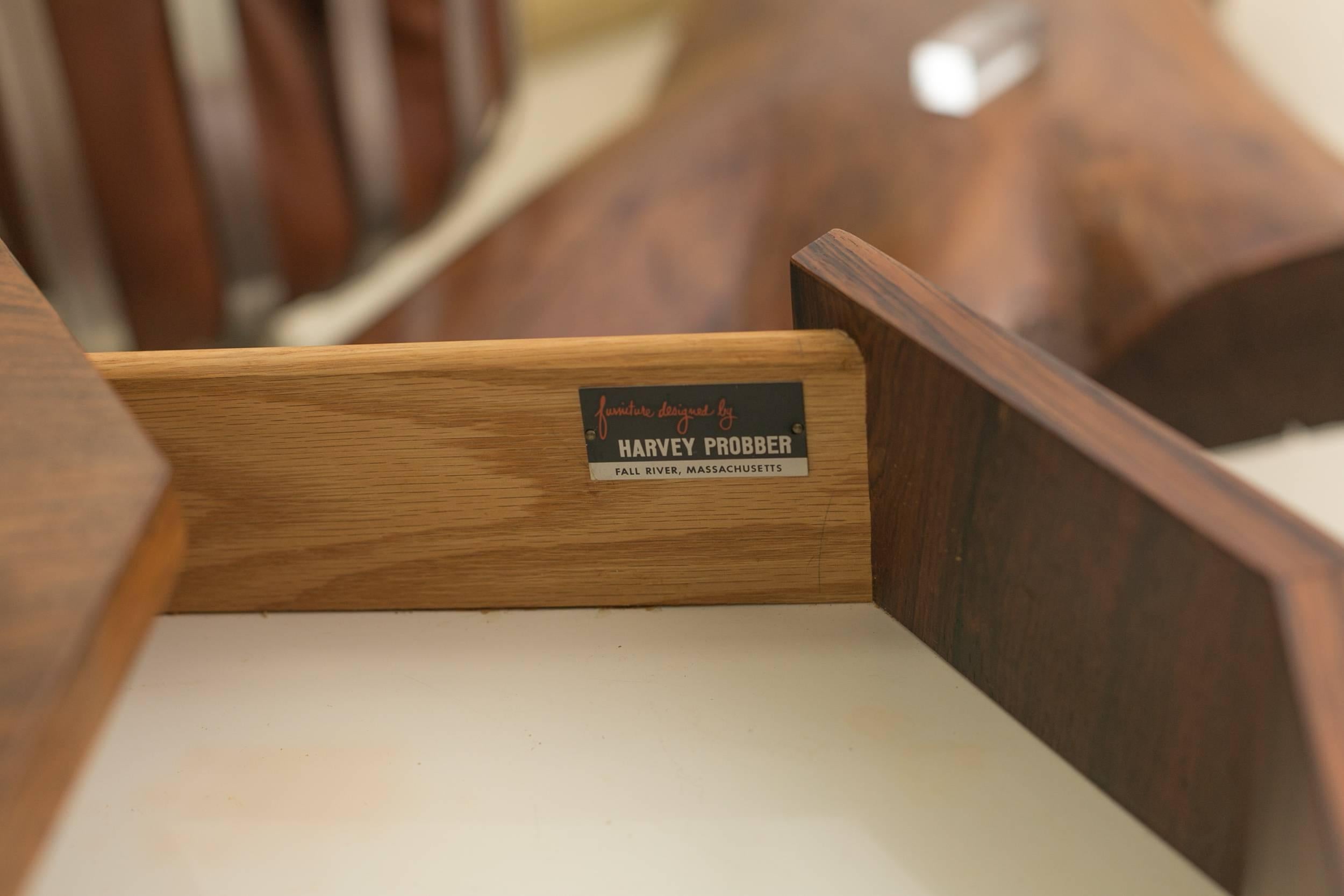 Rosewood decagon bar table by Harvey Probber
with drawer and shelf inside the door.
Ebony pulls and base.
Label at the drawer.
 