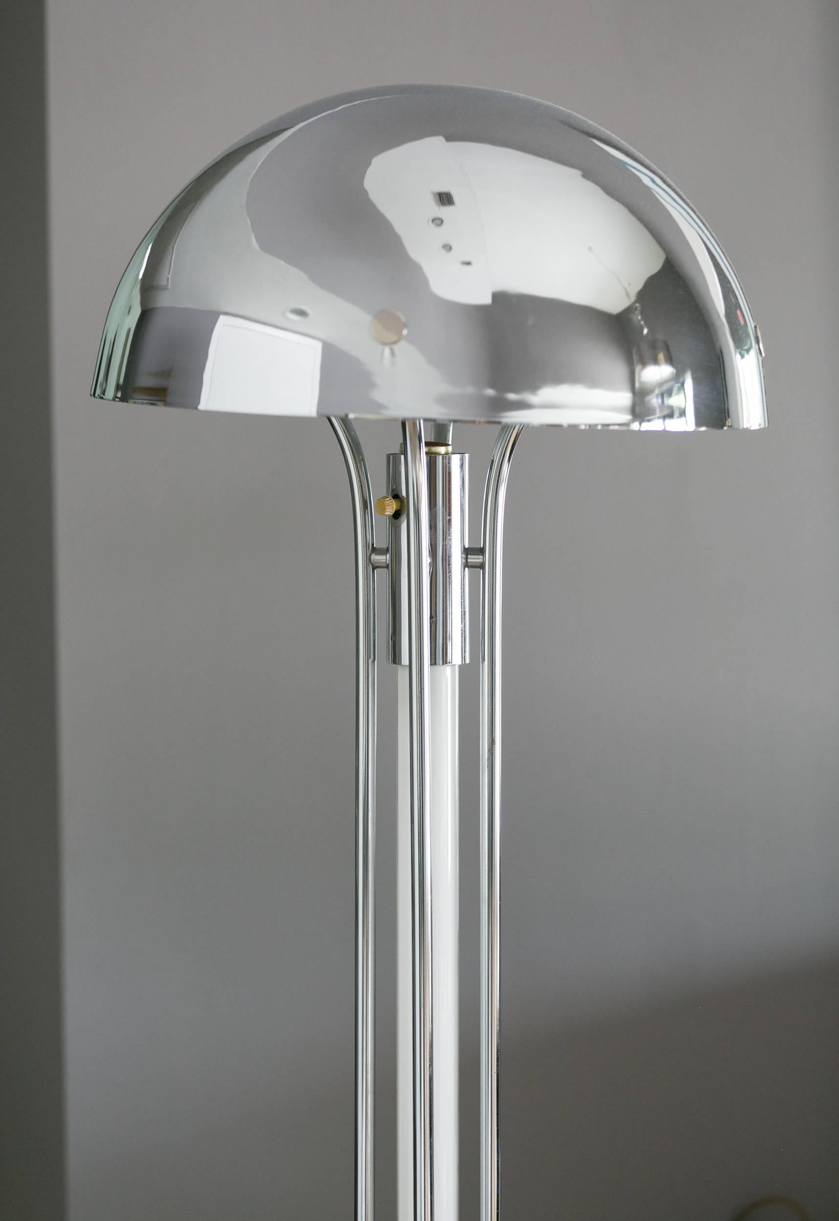 Chrome floor lamp in Jaques Adnet style
with vertical tube ilumination stem supporting.
Dome shaped shade with brass details,
powder coated reflective inside.