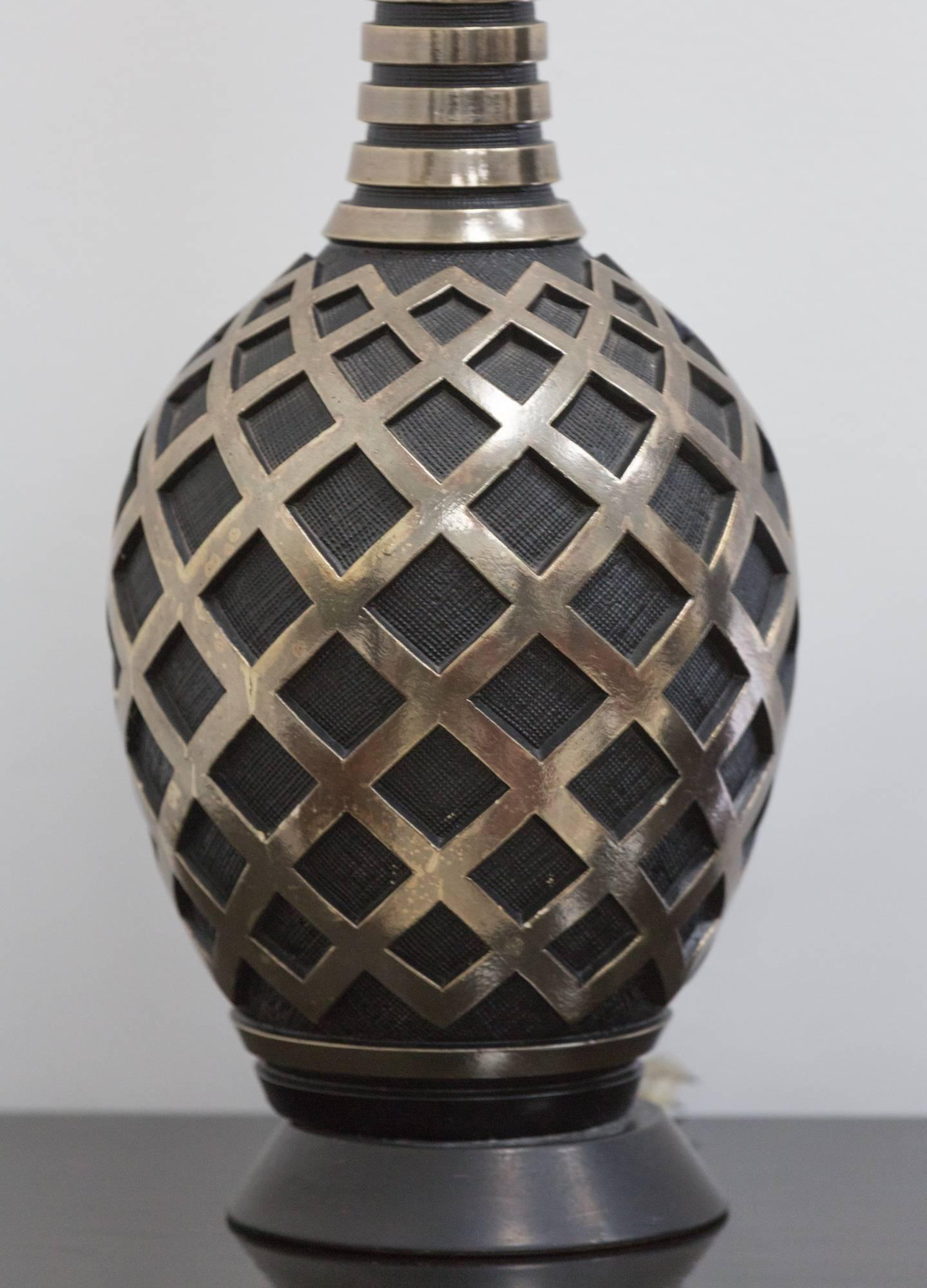 Two-tone metal table lamp 
with articulated basket pattern.
Rewired.