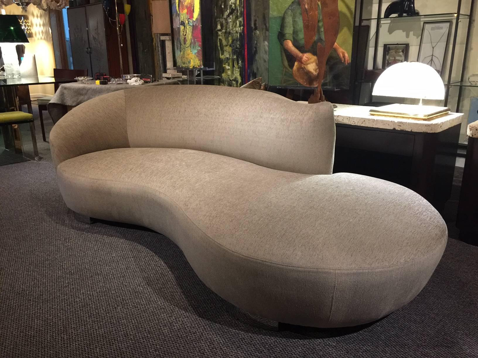 Note: Priced and sold individually.

Perfectly matched pair of newly upholstered cloud sofas designed by American icon Vladimir Kagan for Preview furniture in the 1980s with chrome base feet. Fabric is a Fine silk/chenille blend in soft beige
