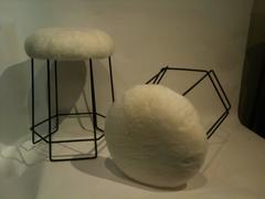 A Set of Three Black Wire and Shearling Stools in the style of Jean Royere