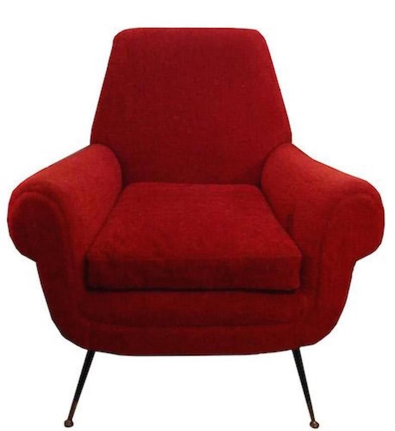Pair of Mid-Century club chairs by Gigi Radice each featuring rolled arms, a tight back and a loose seat cushion all upholstered in their original high pile mohair velvet in bright red. The clubs also feature their splayed tapering black enameled