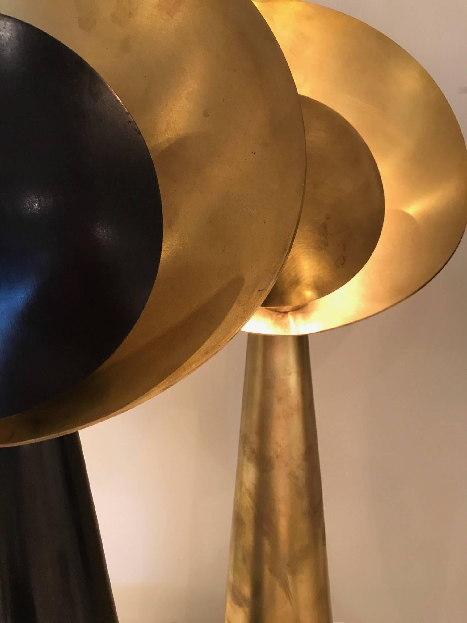 The Helios table lamp is handcrafted in the Paris atelier of Julien Barrault. Available in blackened brass with brass or brass on brass. Made-to-order.