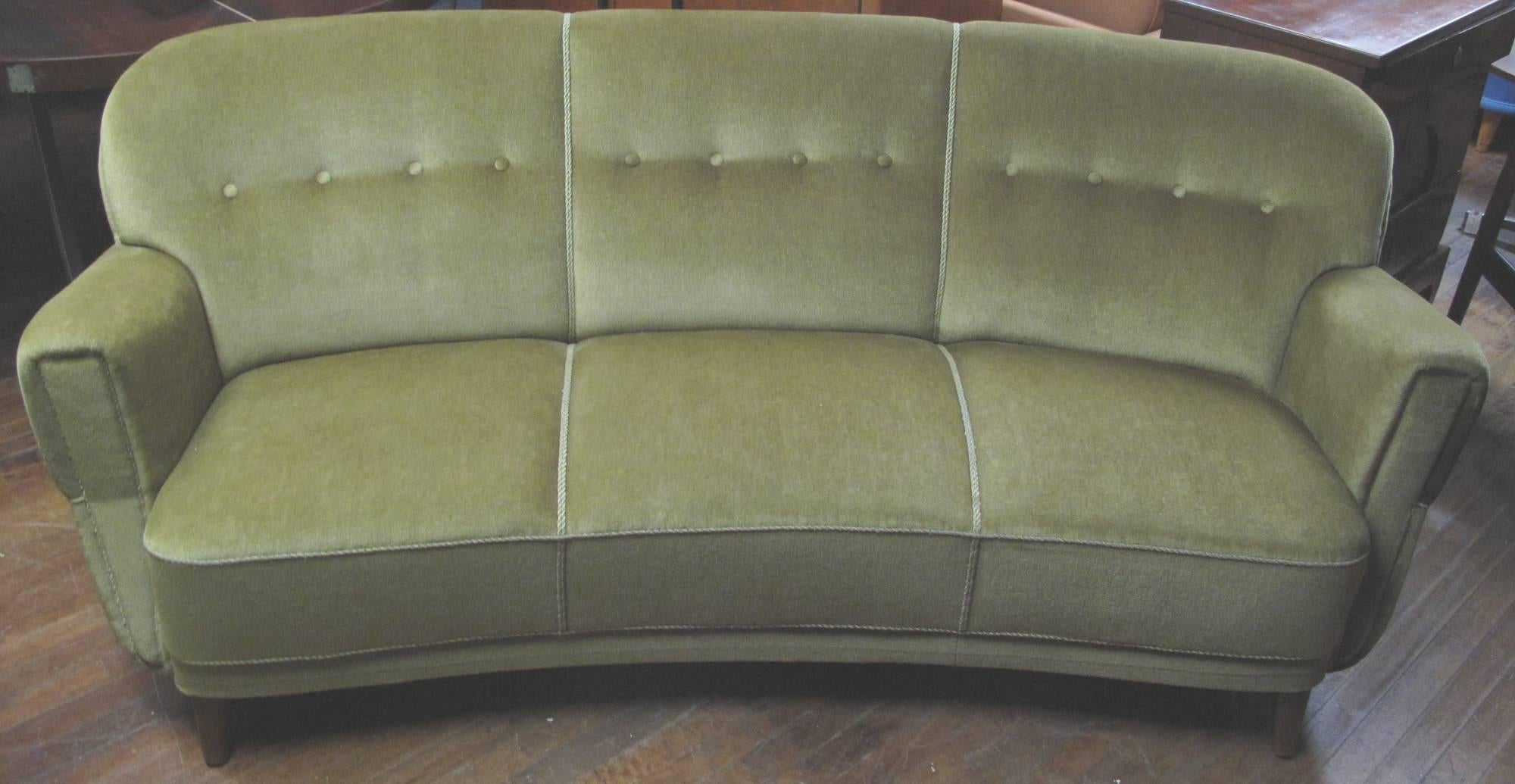 Danish curved three-seat sofa of nice architectural form. The sofa upholstered in mohair.