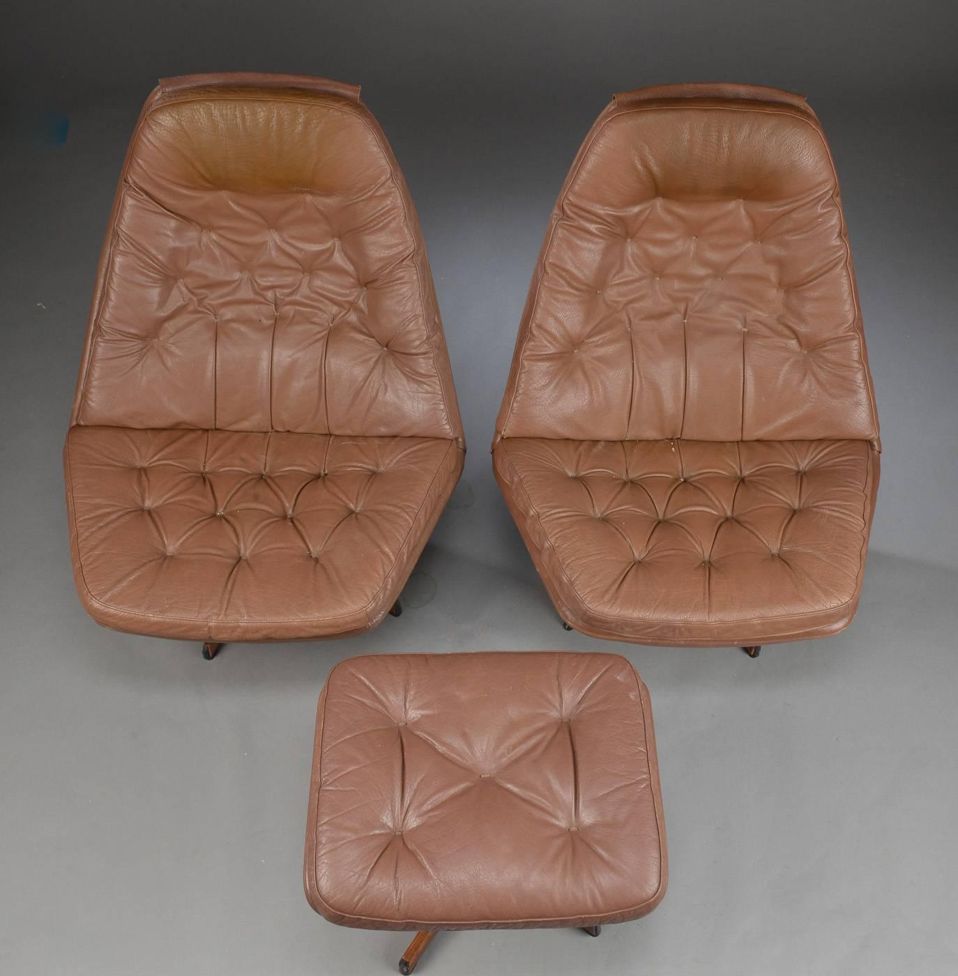 Pair of 1960s Danish leather swivel chairs with one ottoman in light brown.   The chairs have five star bases and the ottoman four.   The chairs and ottoman designed by  by Ib Madsen and Acton Schubel, model MS68. The ottoman measure 16 inches high