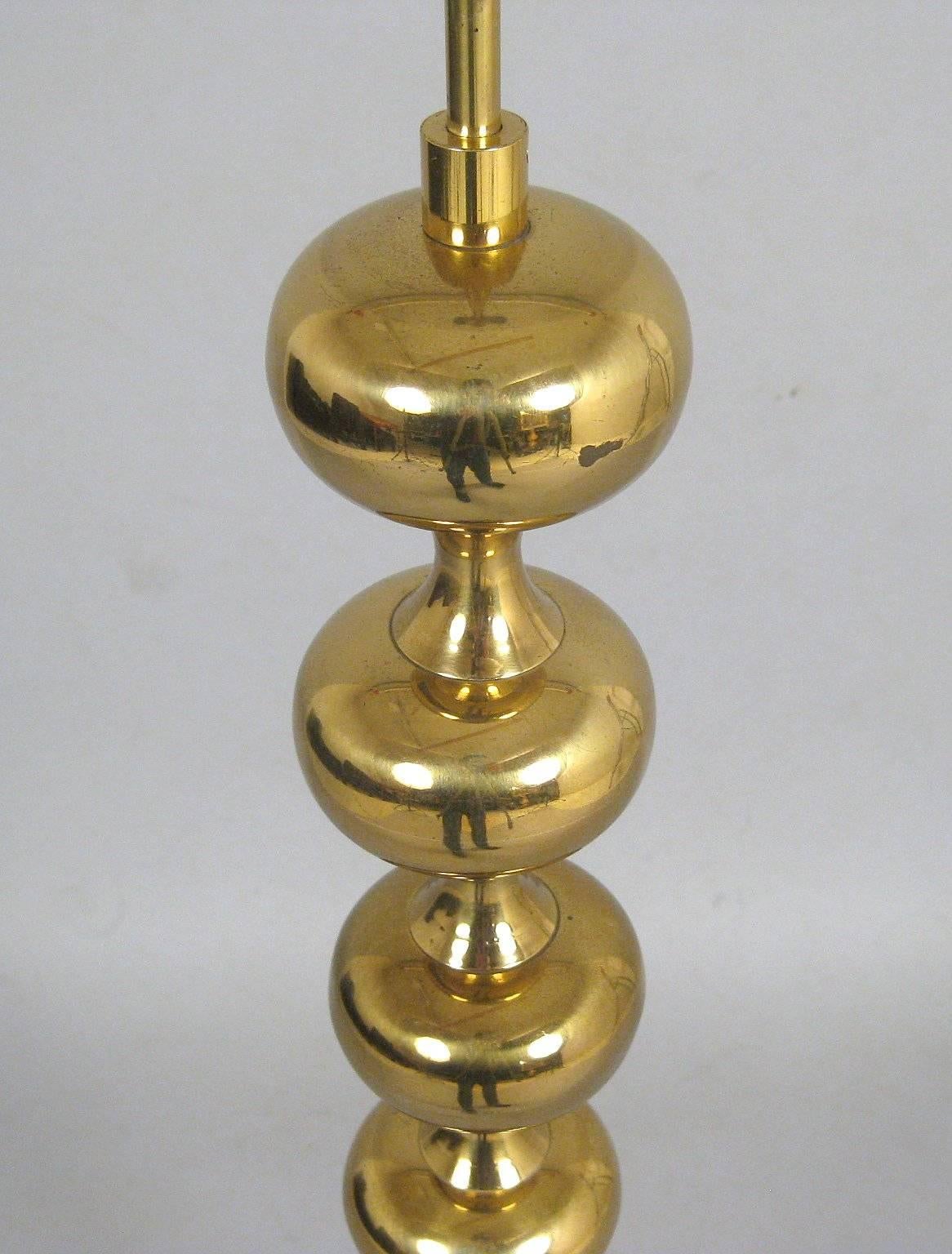 Danish brass floor lamp comprised of multiple spheres, 1960s-1970s.