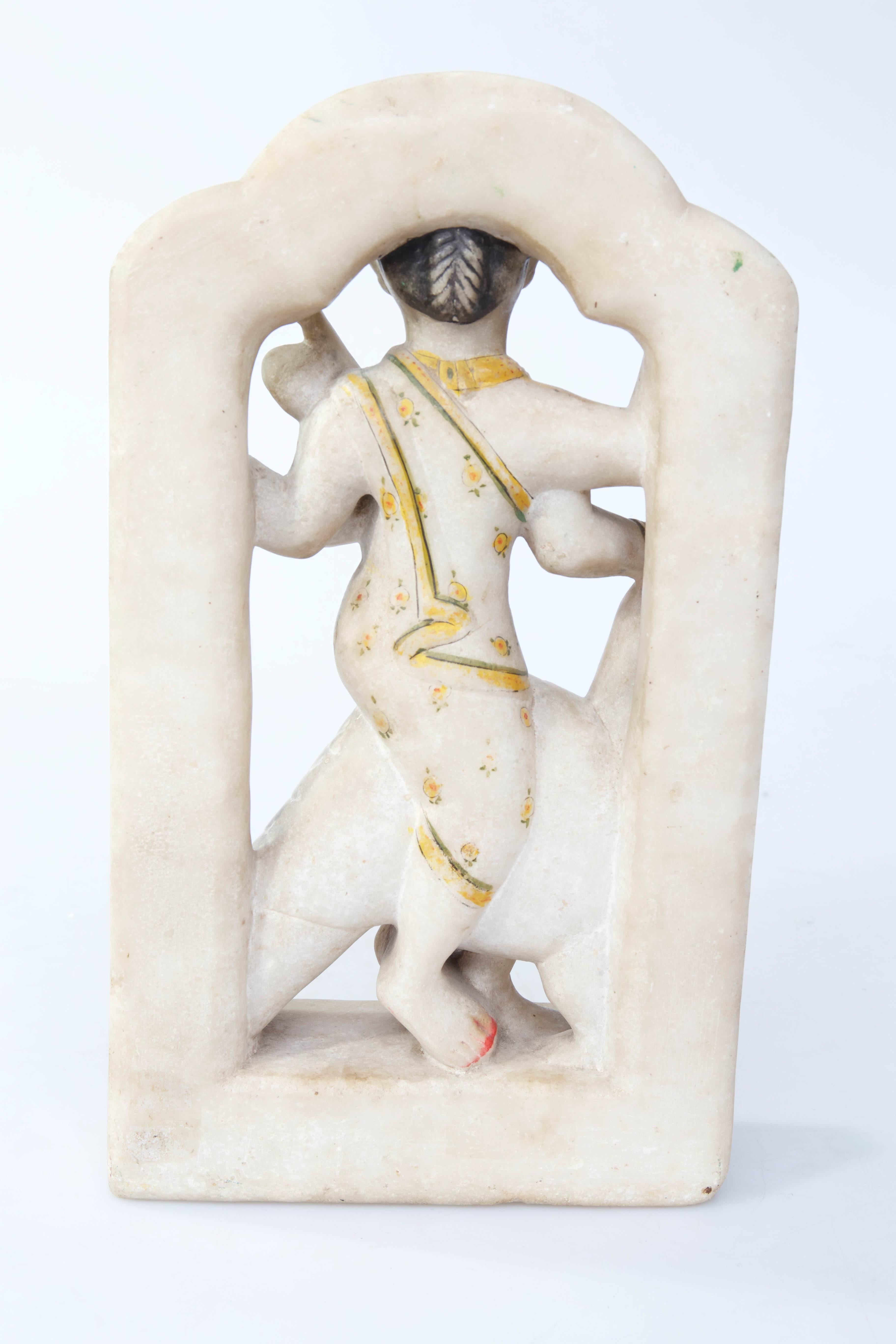 Indian parcel-gilt alabaster sculpture of Indian deity with bird, circa 1800 or earlier.