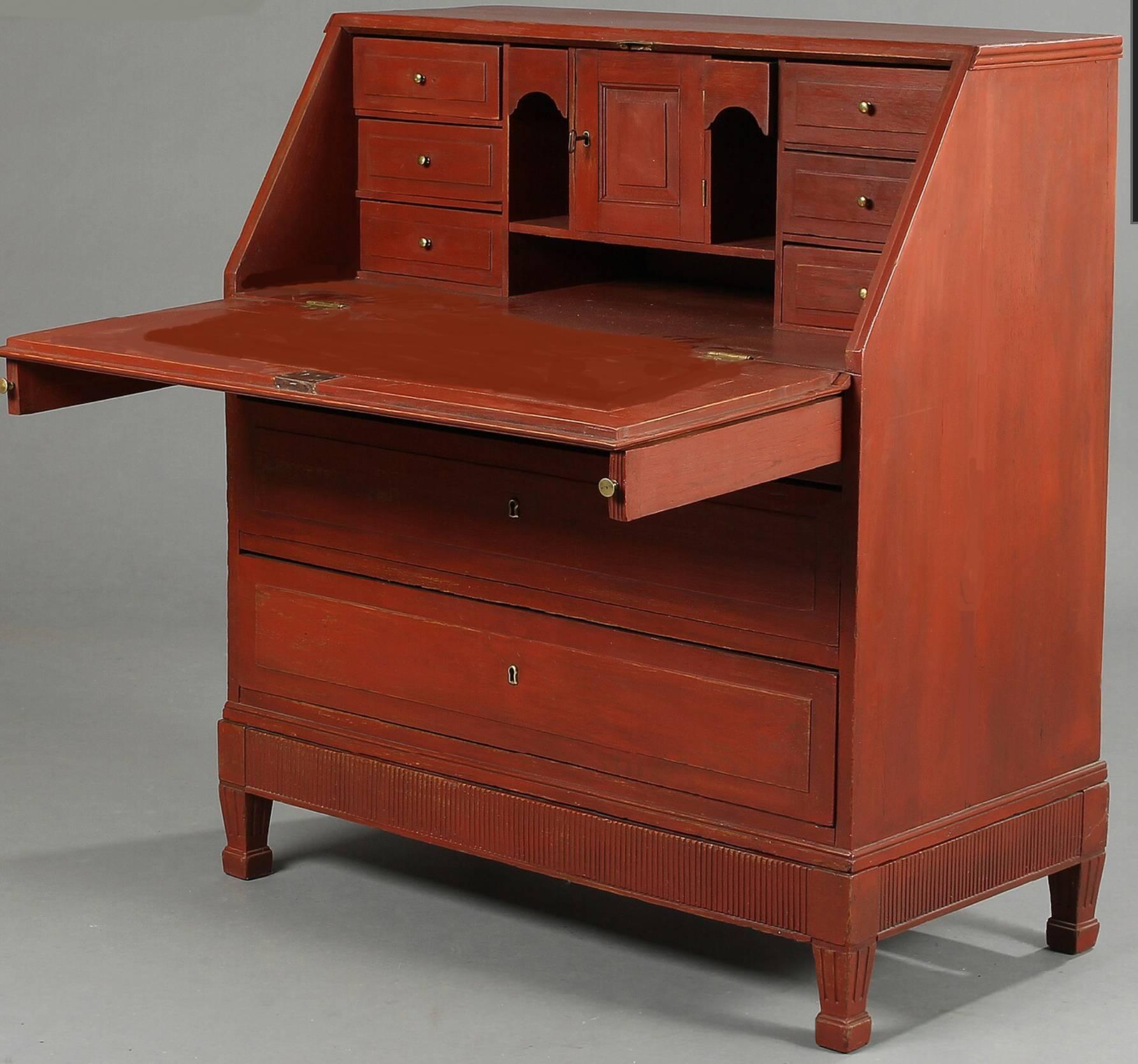 Danish 18th century oak bureau desk with red painted surface. The desk in the manner of Louis XVI. The fall front opening to an interior fitted with pull-out drawers and pigeon holes, circa 1780.