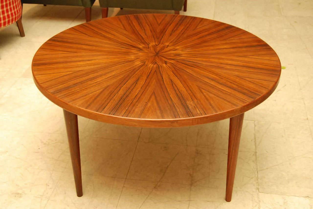 Danish modern rosewood coffee table, the top having the rosewood grain beautifully matched in a sunburst pattern, circa early 1960s.