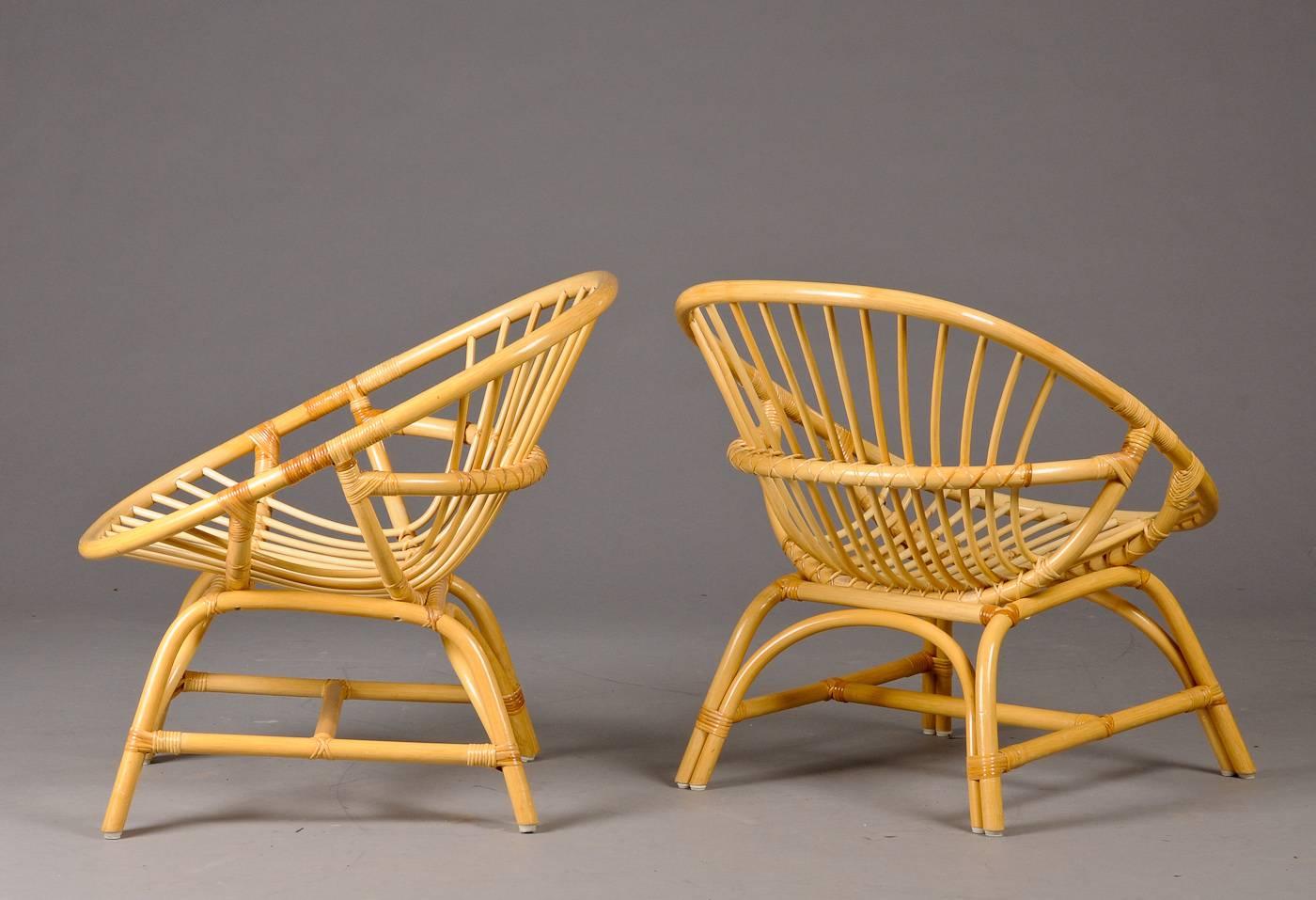 Pair of Danish Rattan hoop form Rattan armchairs. Early 1960s.