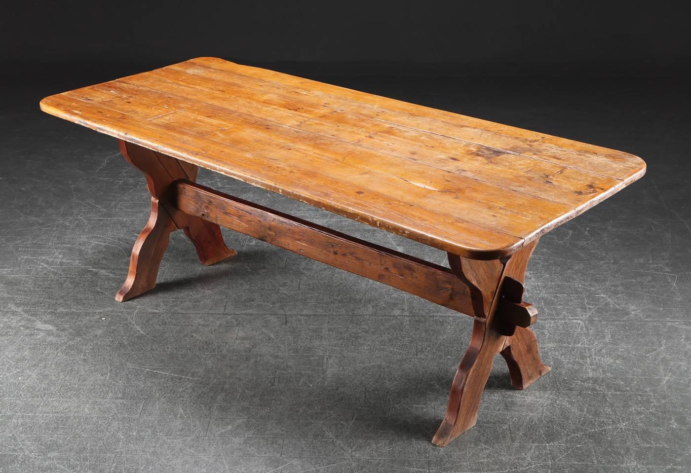 Turn of the century Danish rectangular country pine trestle table with crossbar legs (bolted for stability).