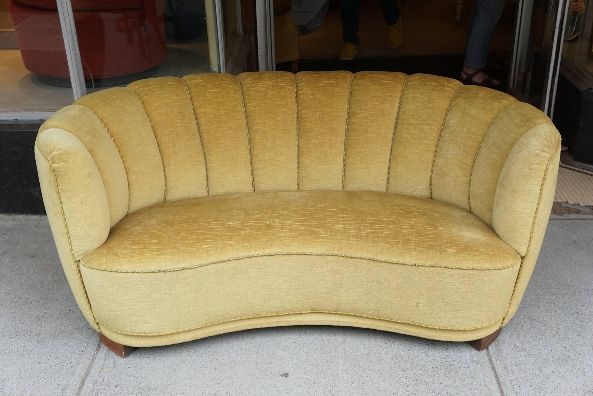 Danish Mid-Century Modern banana form sofa covered in gold mohair from Slagelse Møbelvaerk with channelled back and beech legs. Very comfortable.