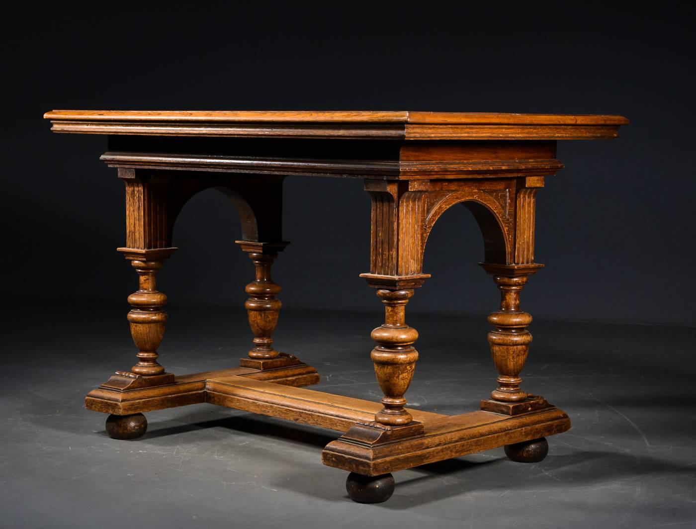 Danish late 19th century games table in the Renaissance taste. The tabletop inset with a chessboard. The top supported urn carved legs on a T-shaped molded base ending in bun feet.