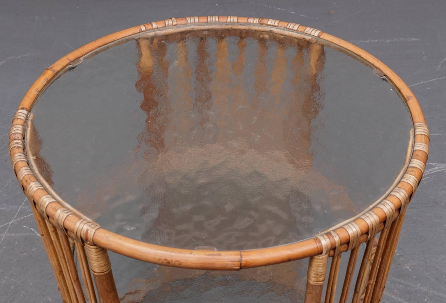 Danish rattan table in the style of Viggo Boesen, 1940s Danish modern,
with frosted glass top.