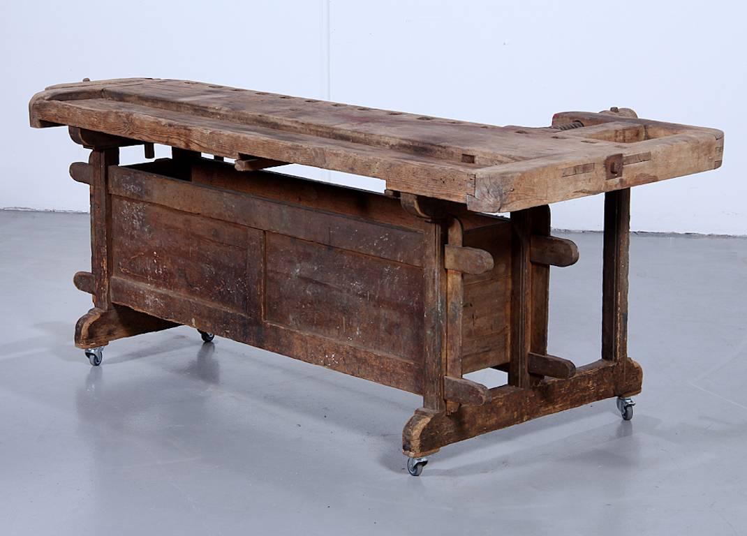 Classic early 20th century heavy duty worktable from Europe in pine.
With good capacity for tools in a set of drawers underneath.