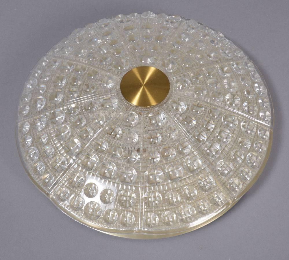 Pressed glass floating flush mount by Lyfa for Orrefors of Sweden. 
More available.