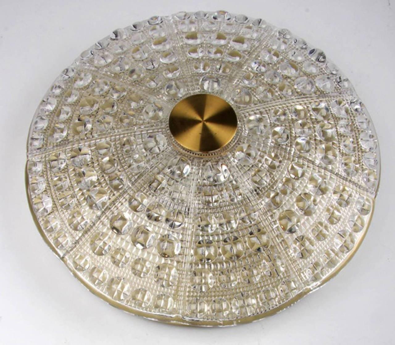 Brass-mounted pressed glass ceiling fixture suspended from a ceiling mounted brass disk. Designed by Carl Fagerlund of Sweden, circa 1950s. Note: We have several of this type model.