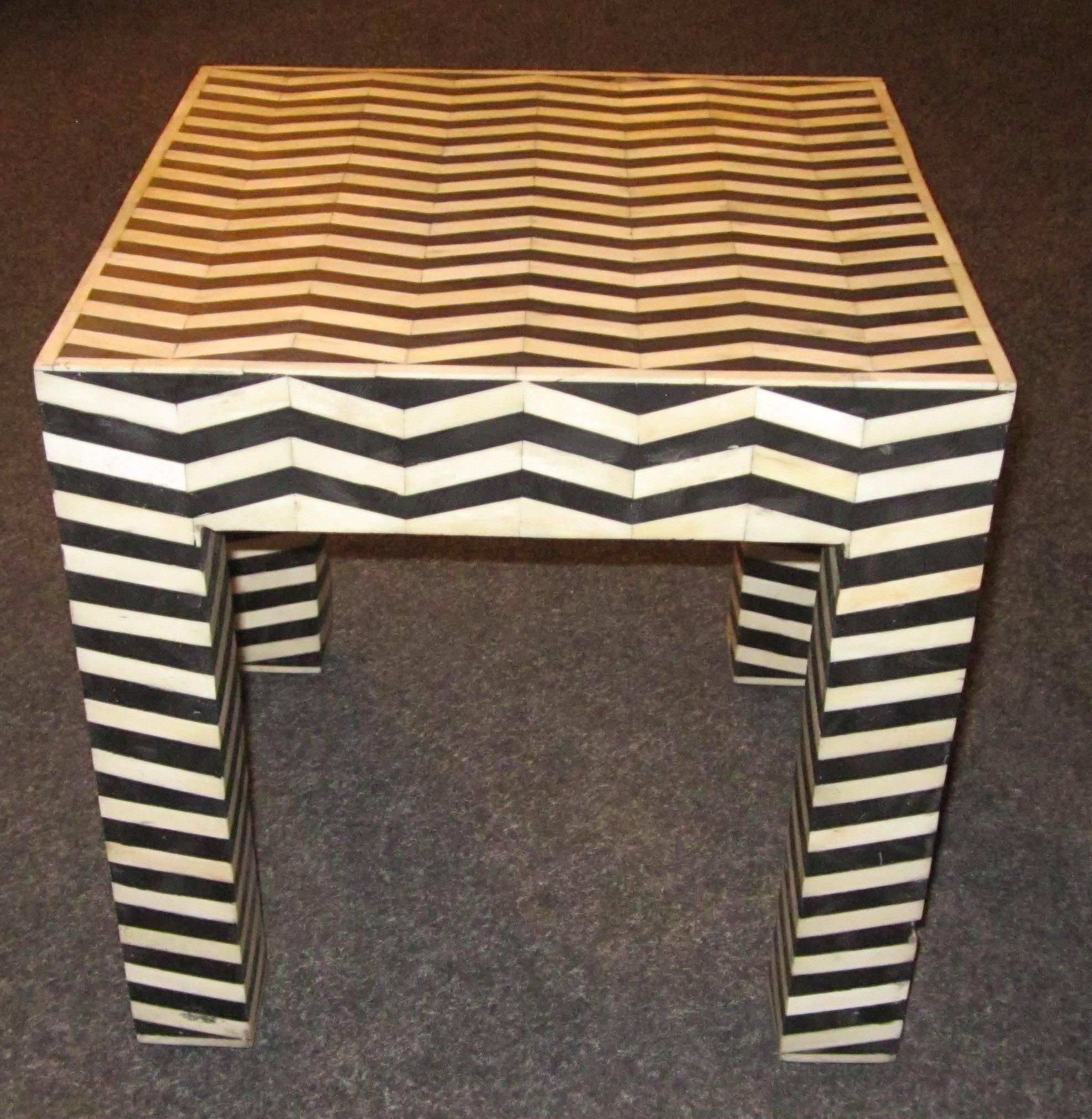 Contemporary Indonesian black and white faux bone and horn square side table.
Two are available.
   