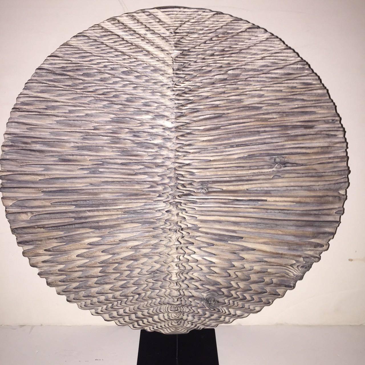 Hand-carved contemporary wood disc sculpture from France.
Made from Douglas Fir.
