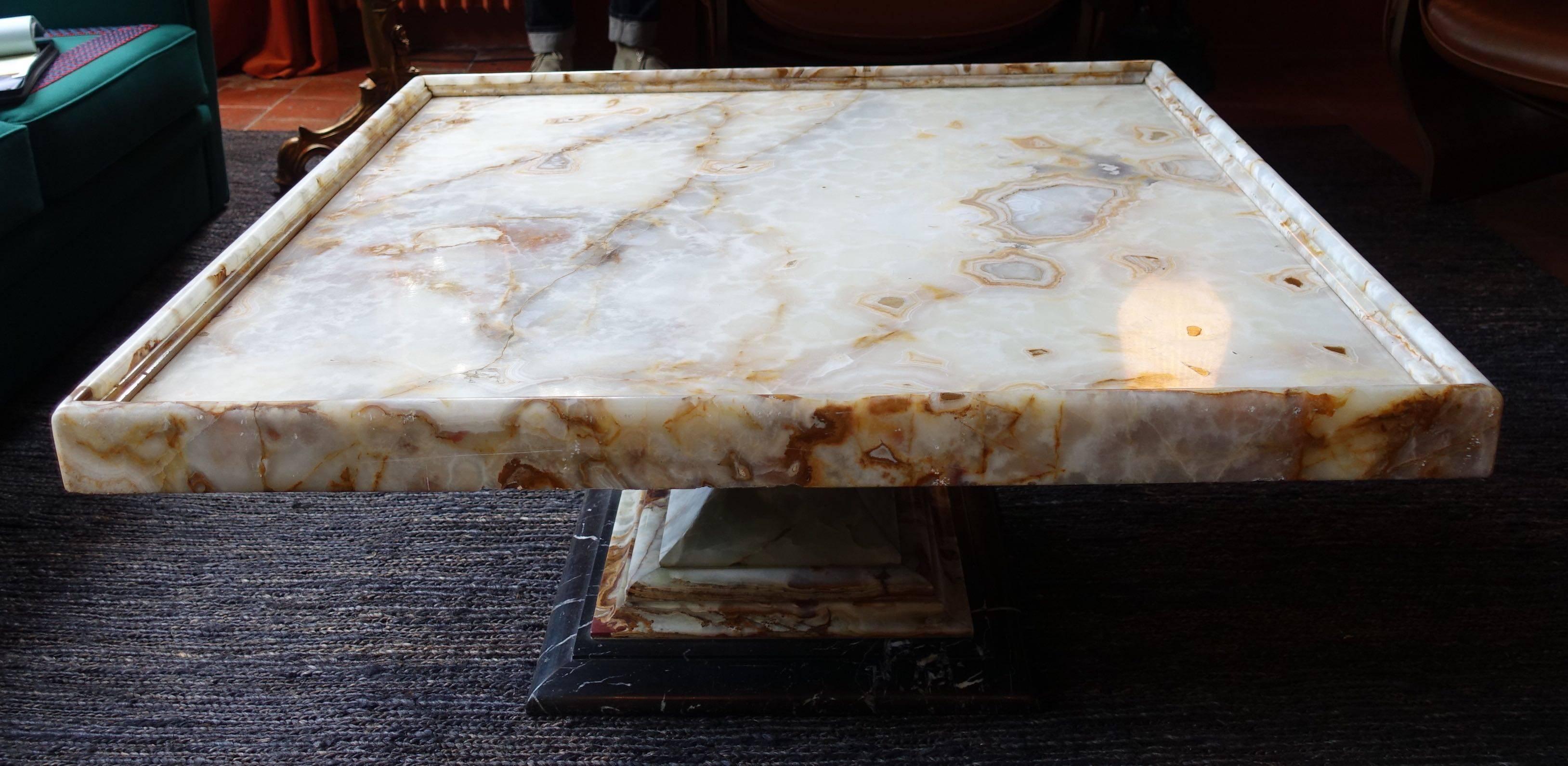 Italian 1960s square top coffee table with an onyx top and marble base.

      