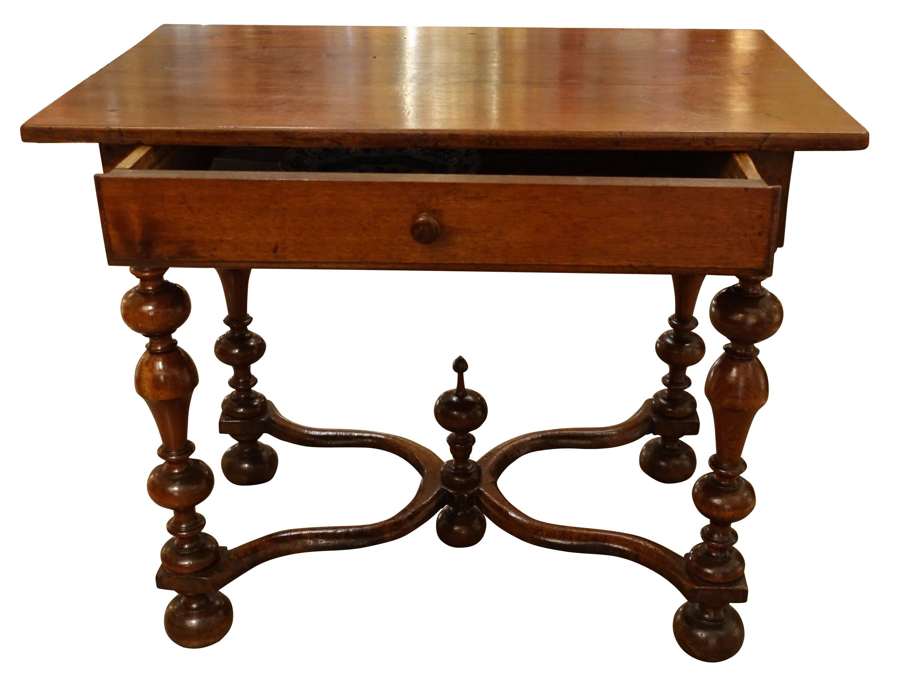 19th century French recently restored walnut large single wide drawer side table.
Spool leg with decorative finial at base.
Criss cross stretcher.
