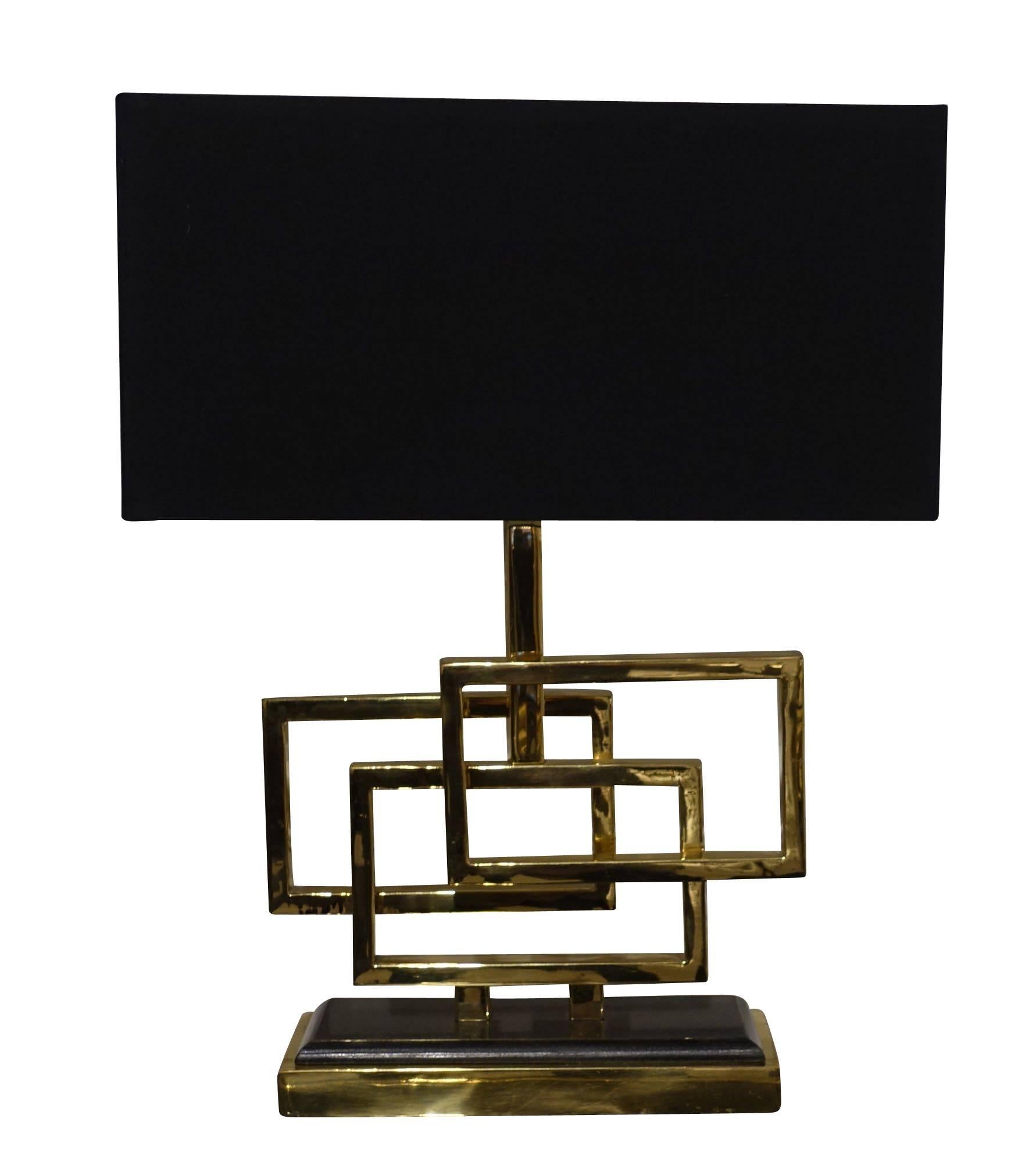Contemporary Belgian pair of lamps with three brass overlapping boxes from decorative base.
Rectangular black shades measure 16