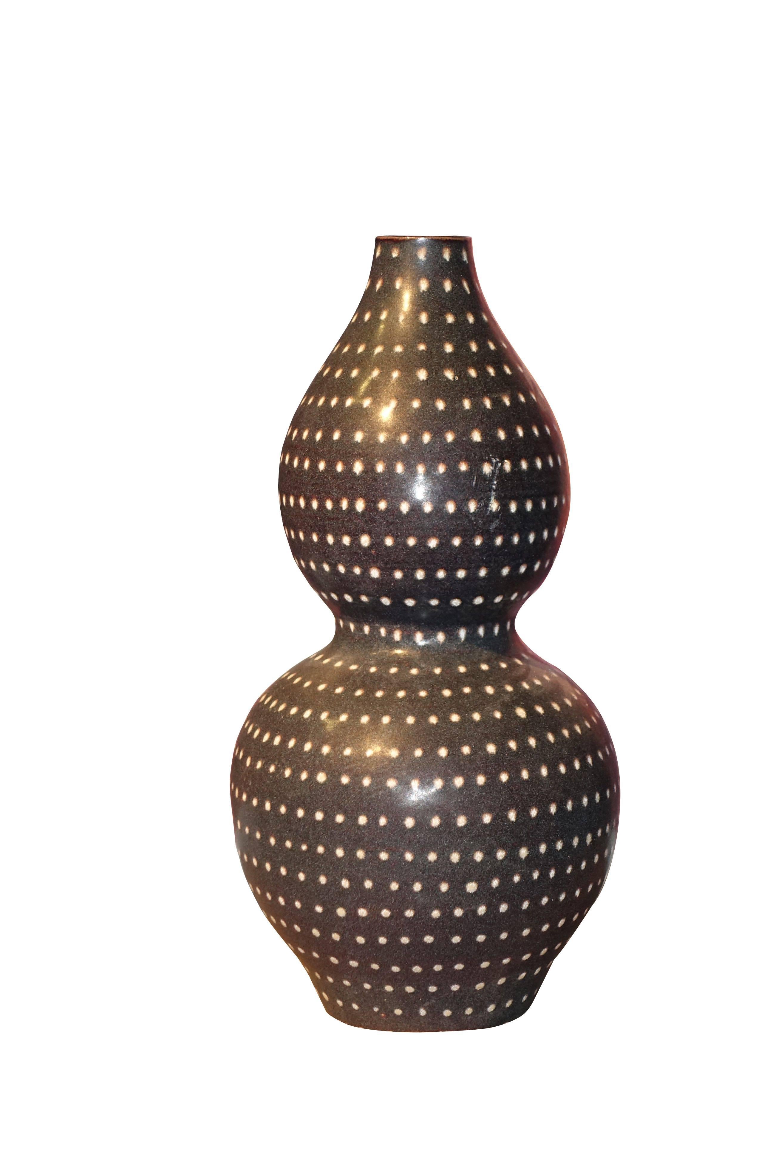 Contemporary Chinese collection of handmade pin dotted vases.
Deep espresso color with cream dots all applied using fine quilled paint brush.
Pieces sold individually and make a very decorative collection.
Measure: S4941A 13