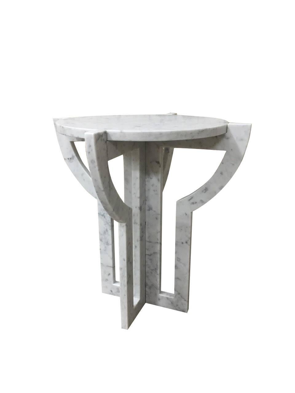 Contemporary round Italian Carrara marble top sites in a very architectural, sculptural base also made of white Carrara.
 