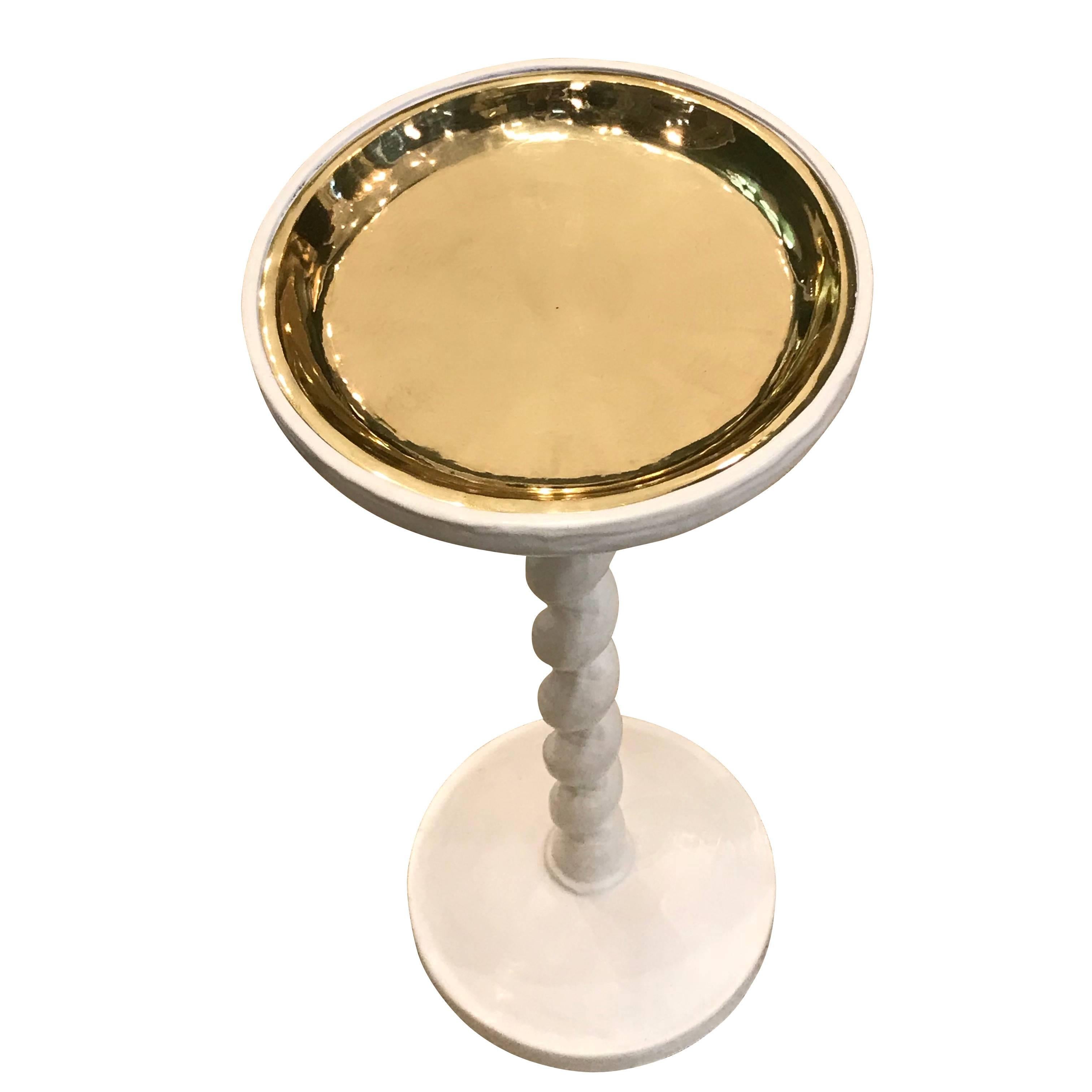 Contemporary English designer Paolo Moschino white plaster cocktail table with metallic gold top.
     