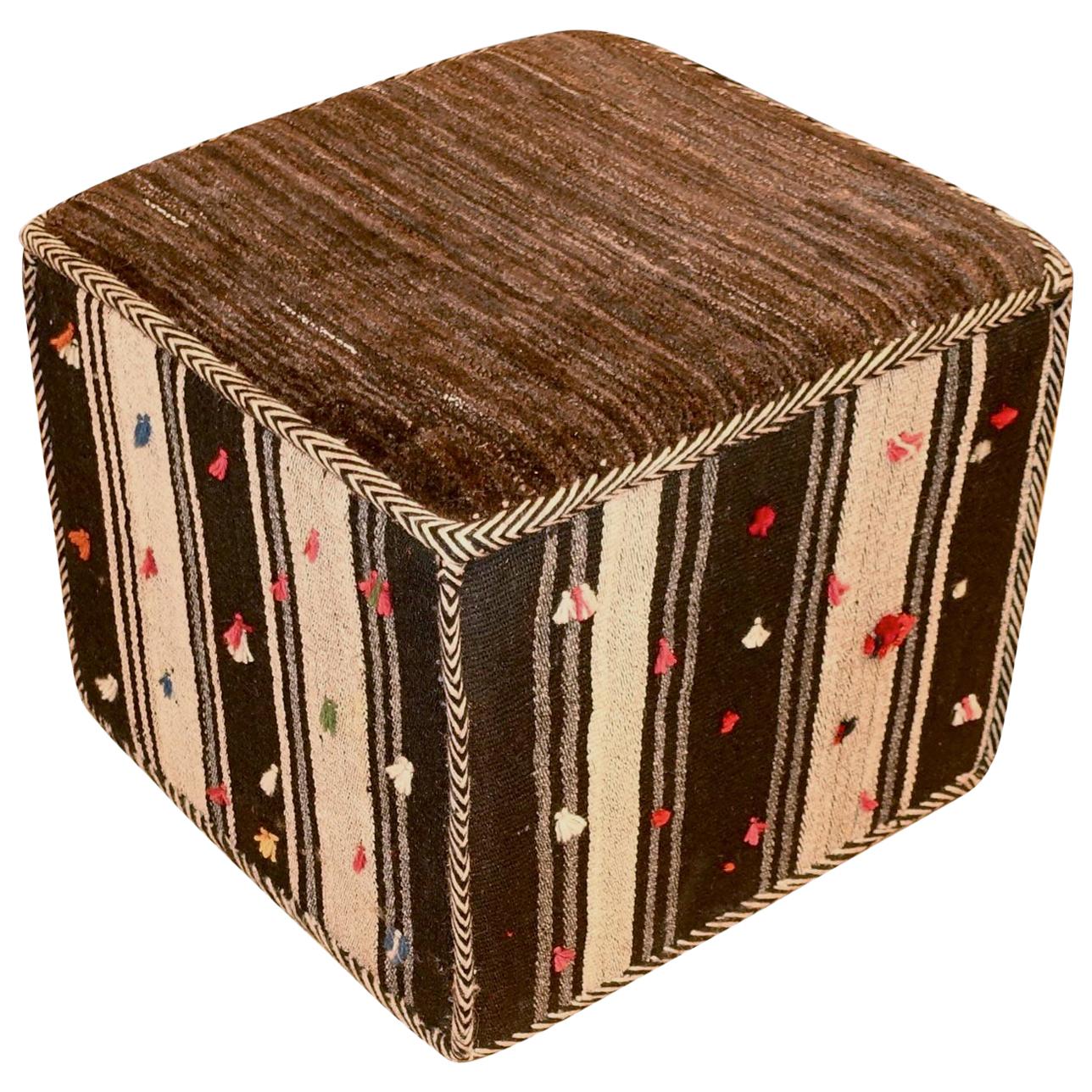 Contemporary Middle Eastern multi stripe with red and white nips Kilim footstool.
Awning stripe with chocolate brown and cream, multi-color nips
Part of a collection of four sold individually.
 