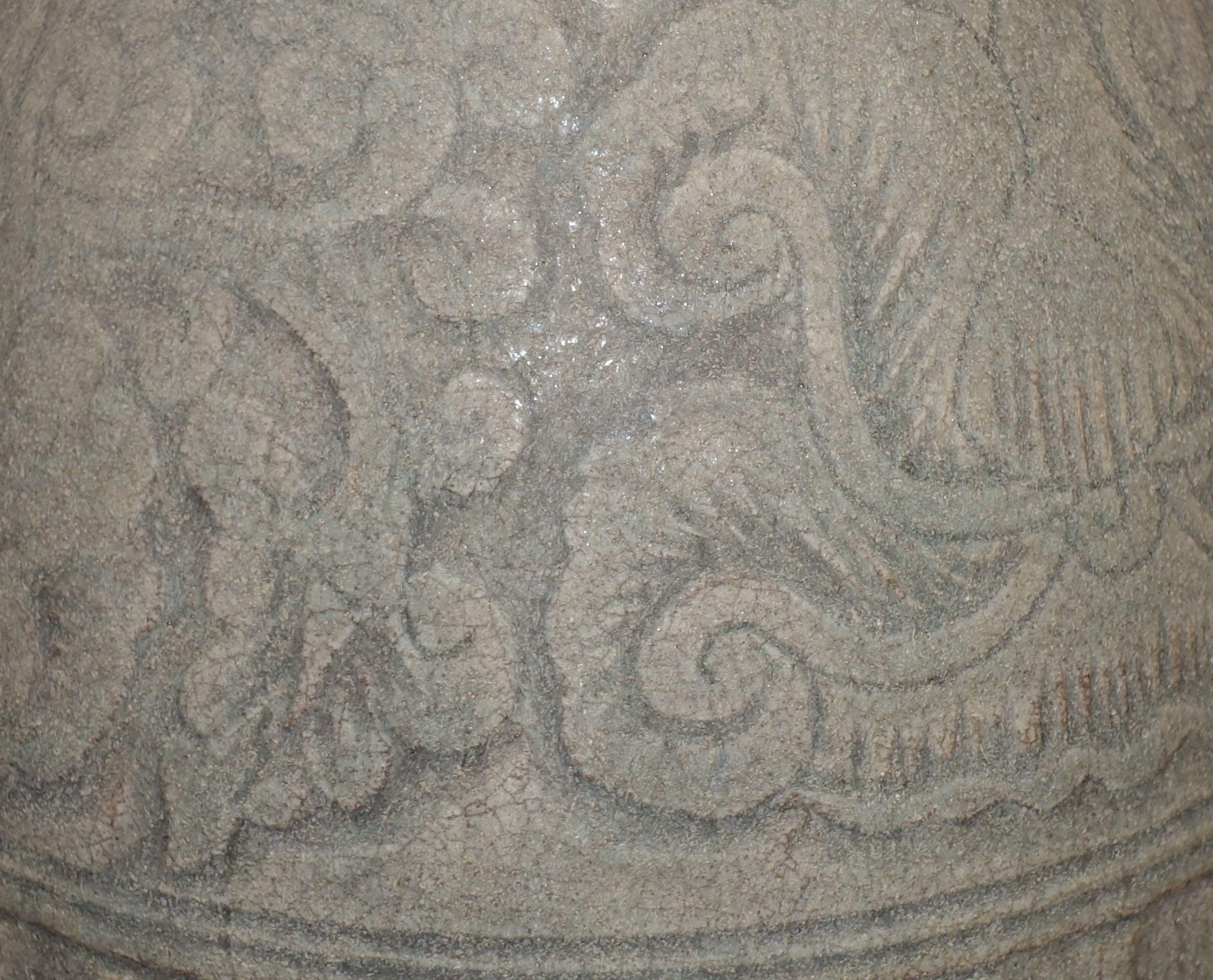 18th century Cambodian dark green terra cotta vase with engraved decorative design.
Rib bottom. 
Natural weathered patina.


  