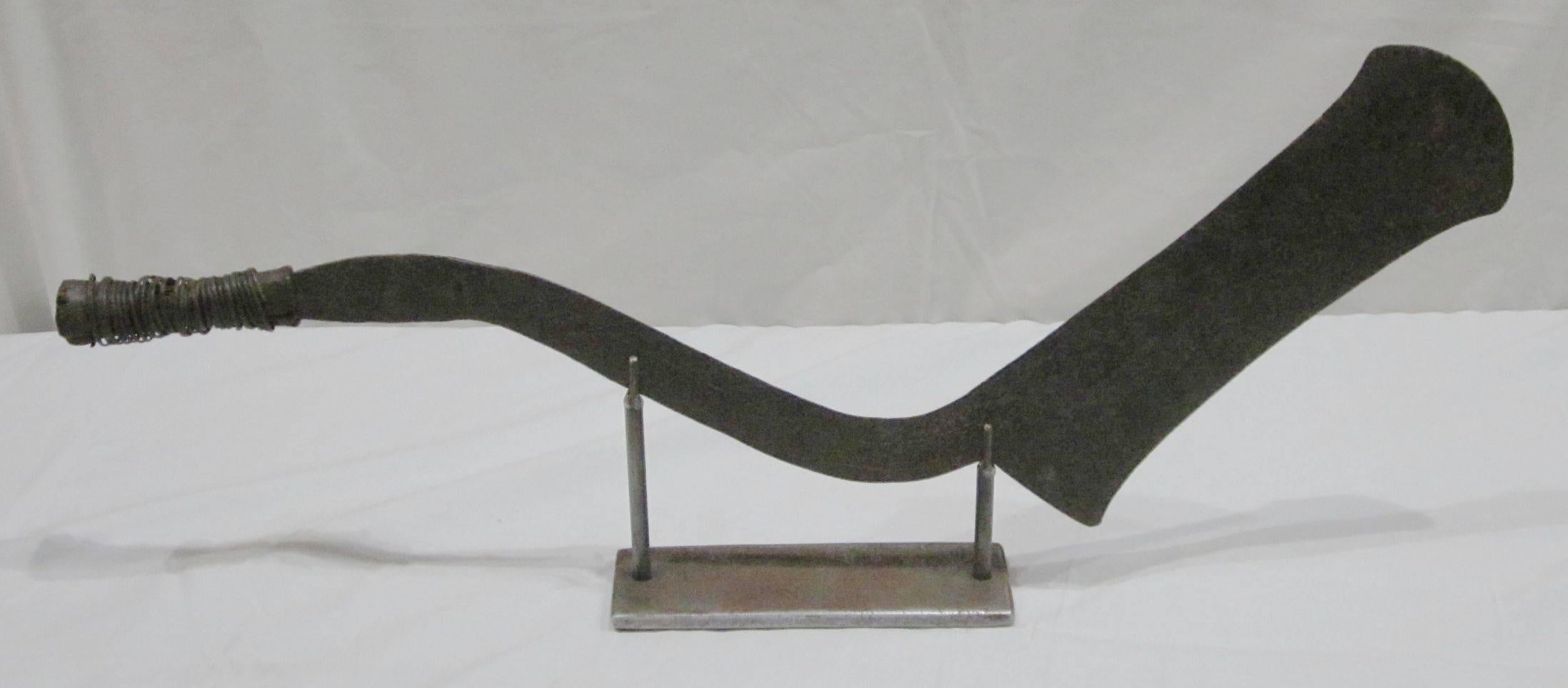 1920s African Congolese sword sculpture on metal stand.
Base measures 10