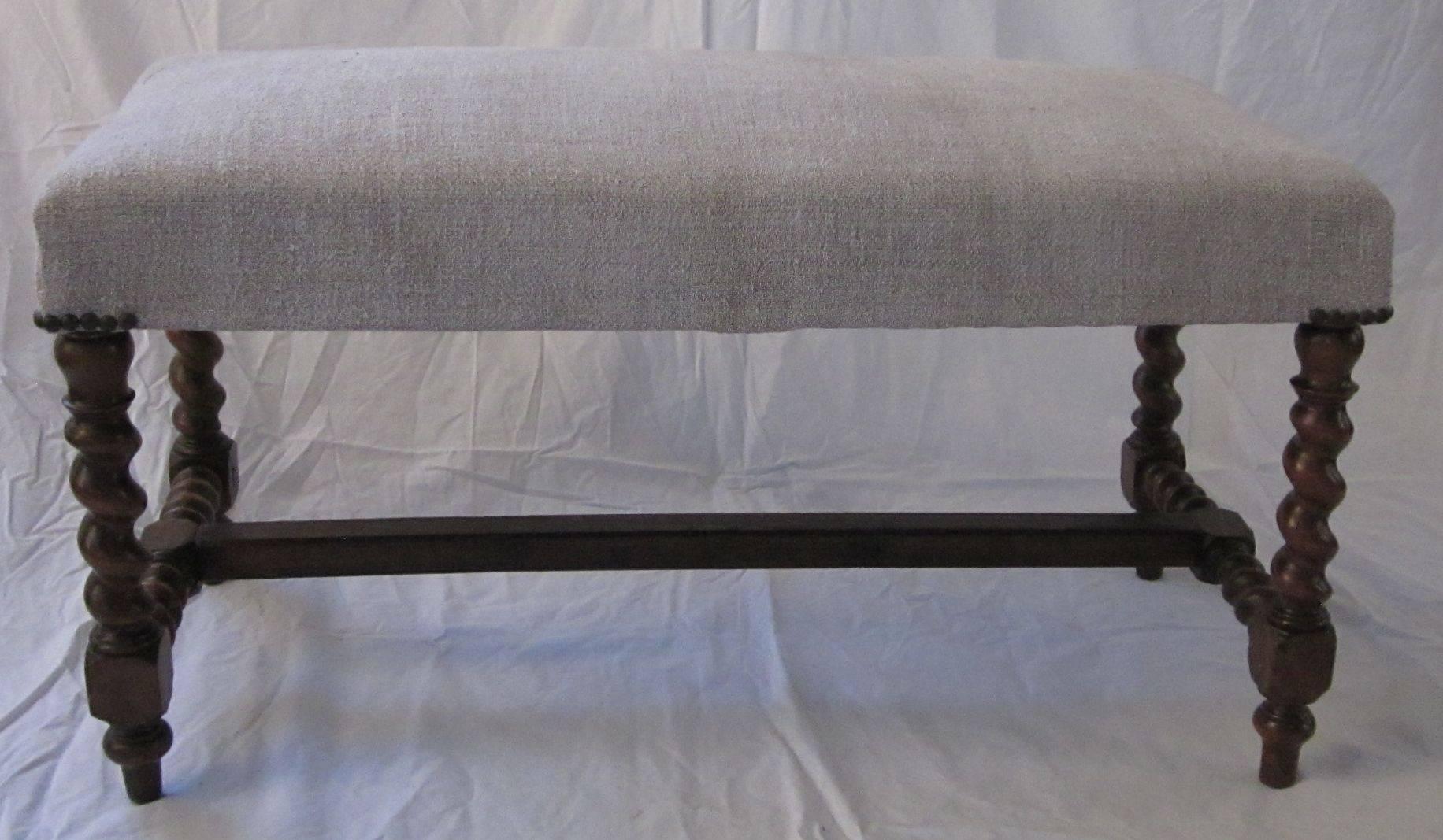19th century Italian spool leg bench.  Legs are spool leg, center bar is flat.
The bench has been recently reupholstered in vintage Belgian linen.
Excellent condition.