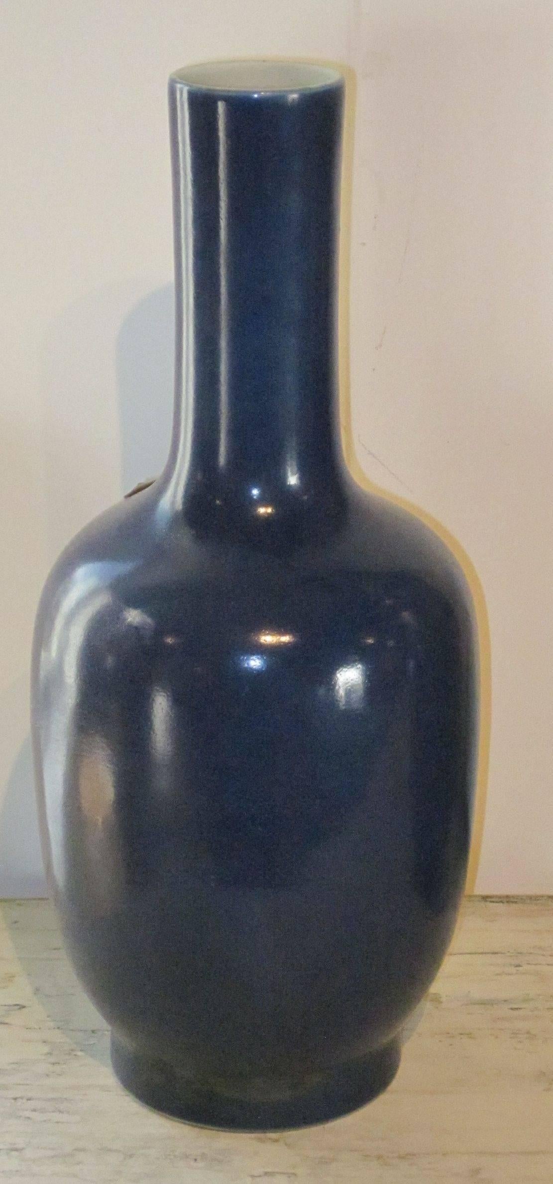 Contemporary Chinese sapphire blue ceramic vase.
Tall tube neck.
Beautiful shade of sapphire with white interior.

